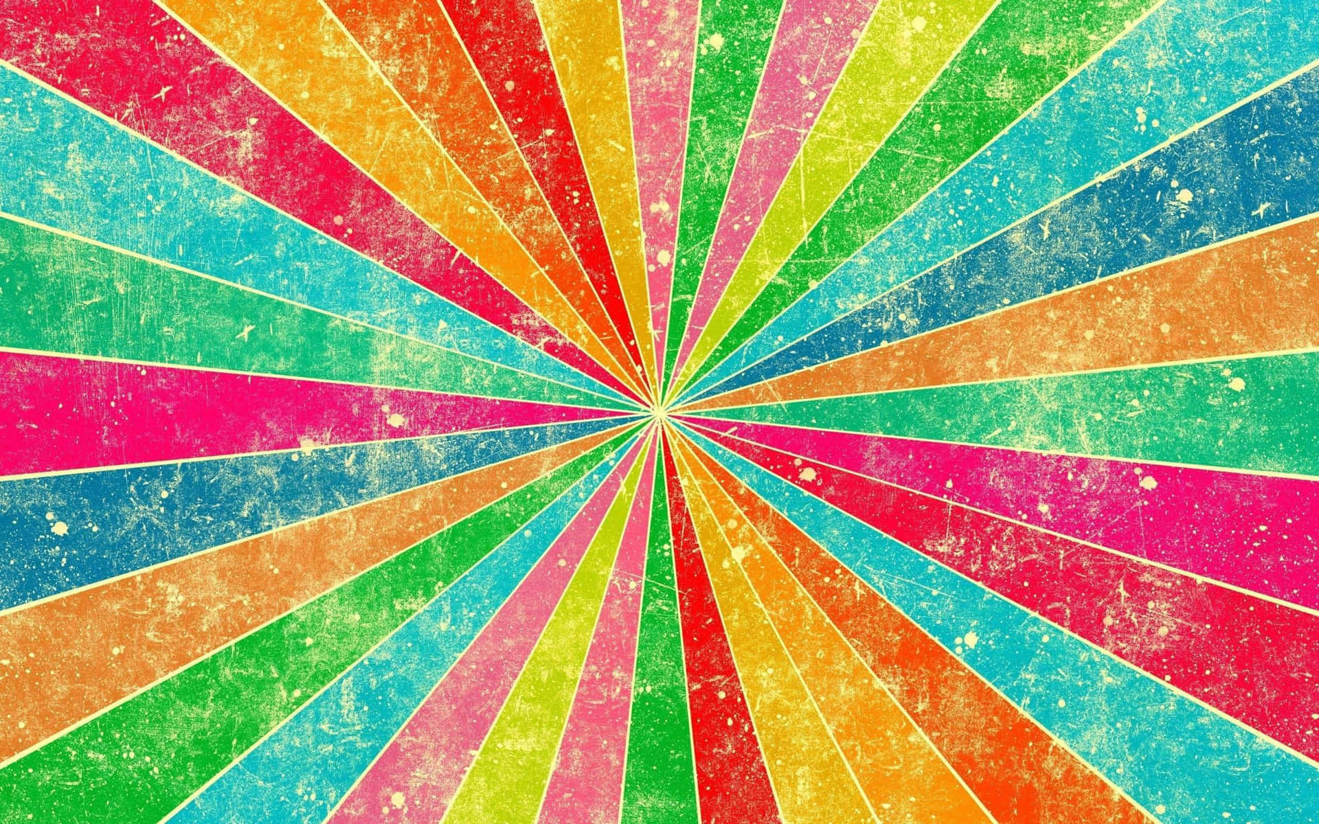 a colorful background with a sunburst