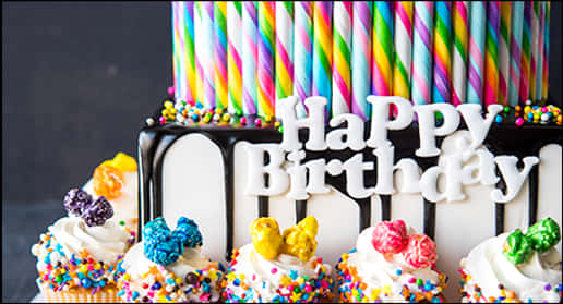 Colorful Birthday Cakewith Cupcakesand Candles PNG