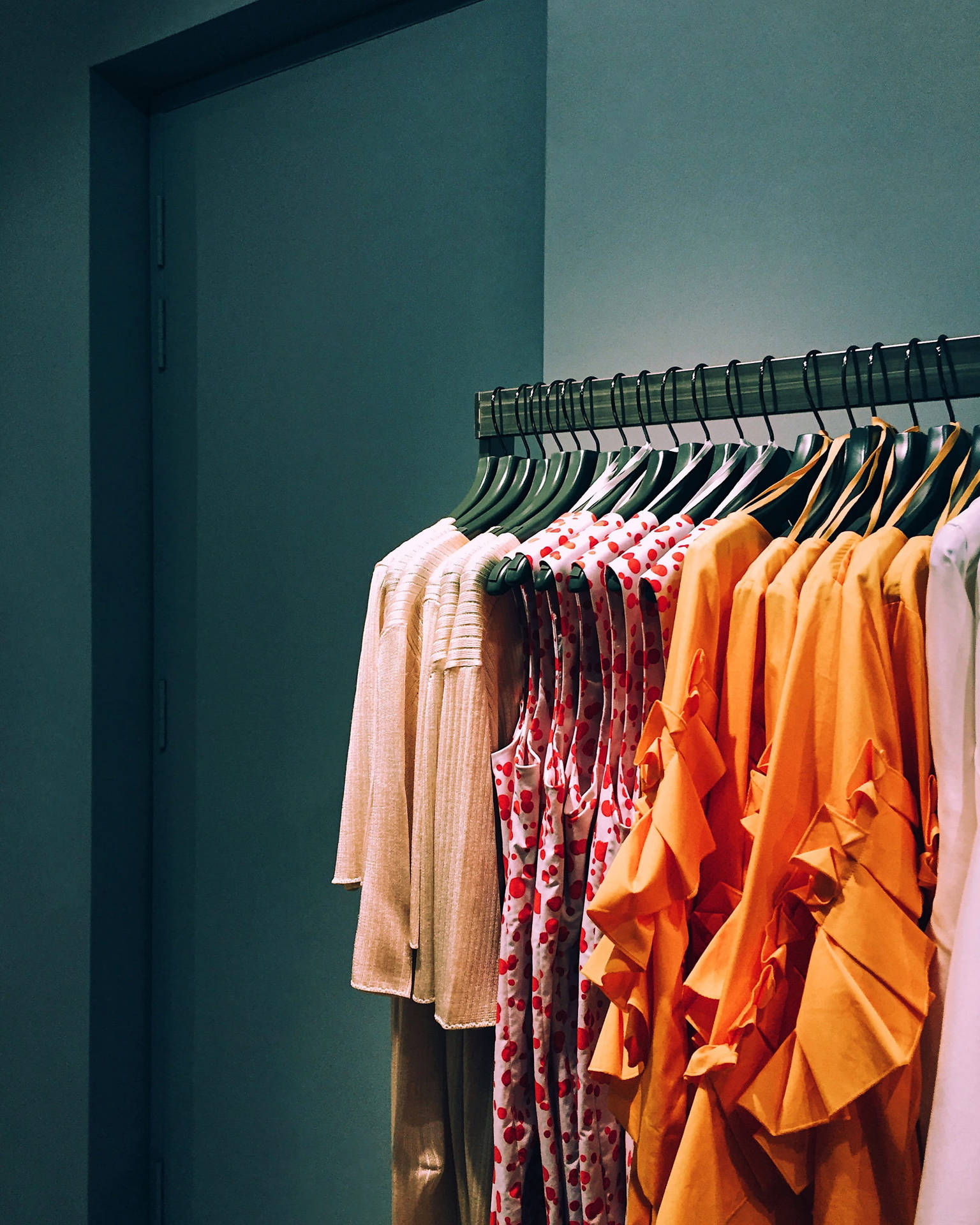 Colorful Clothes On A Rack Background