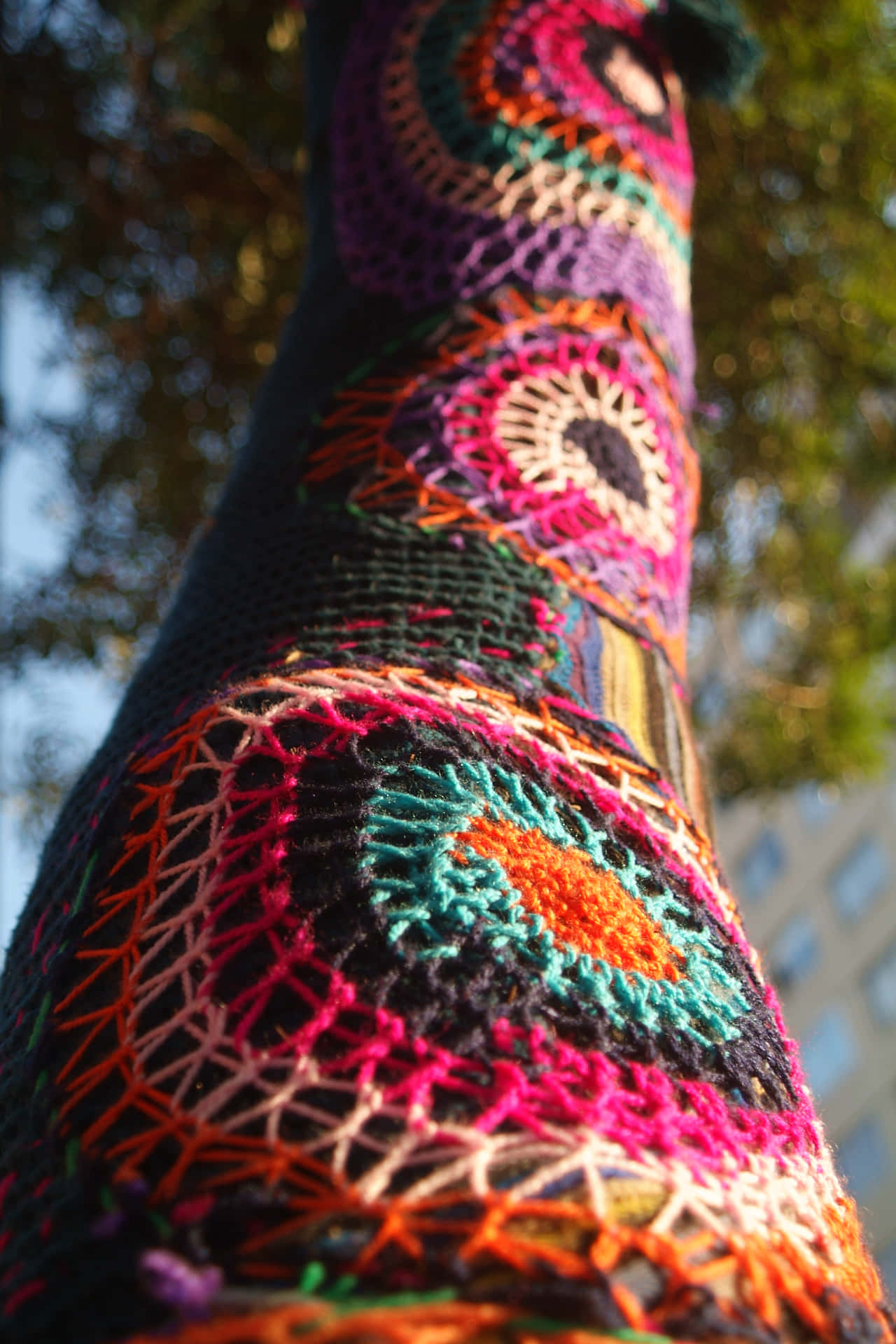 Colorful Crocheted Tree Trunk Using Knitting Yarns Wallpaper