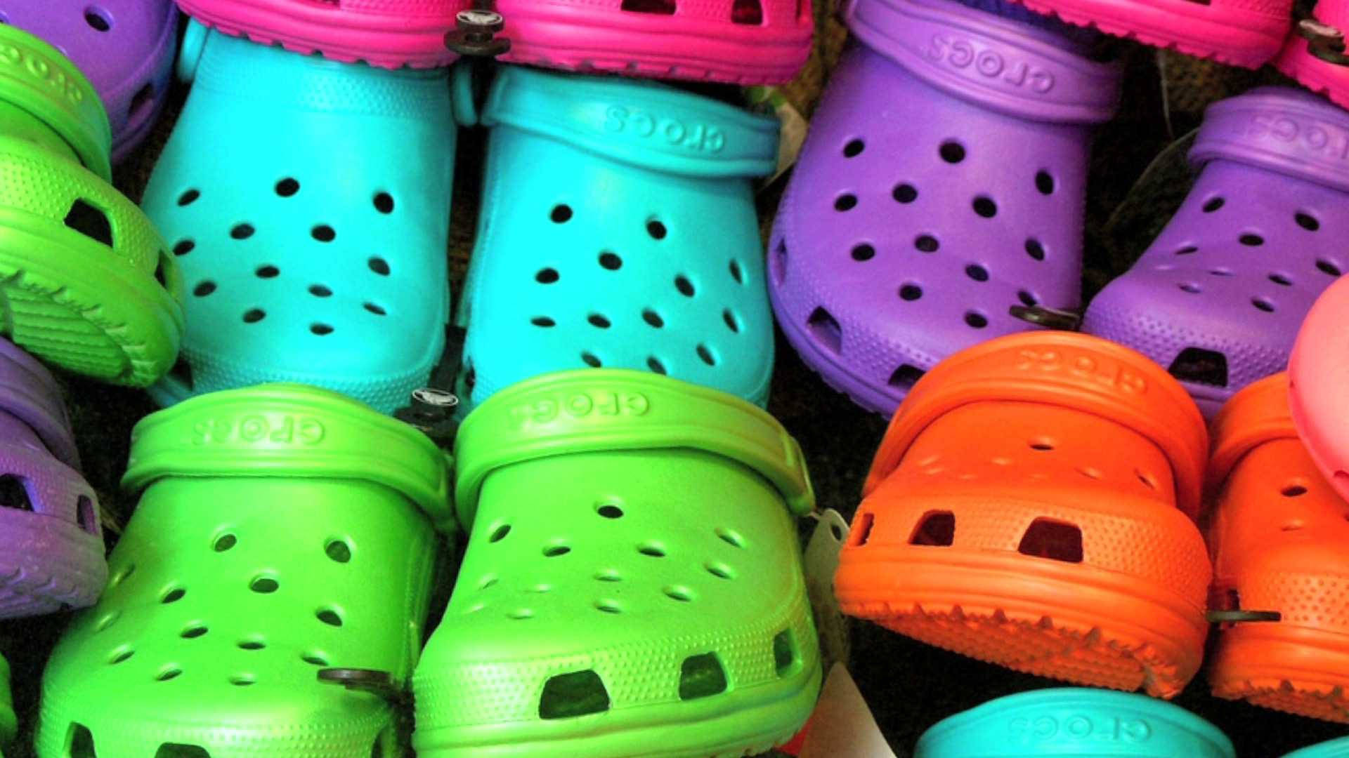 Vibrant Array of Colorful Crocs Shoes Wallpaper