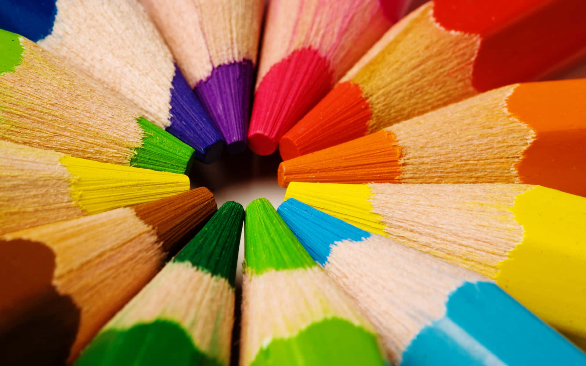 A Close Up Of A Circle Of Colored Pencils Wallpaper