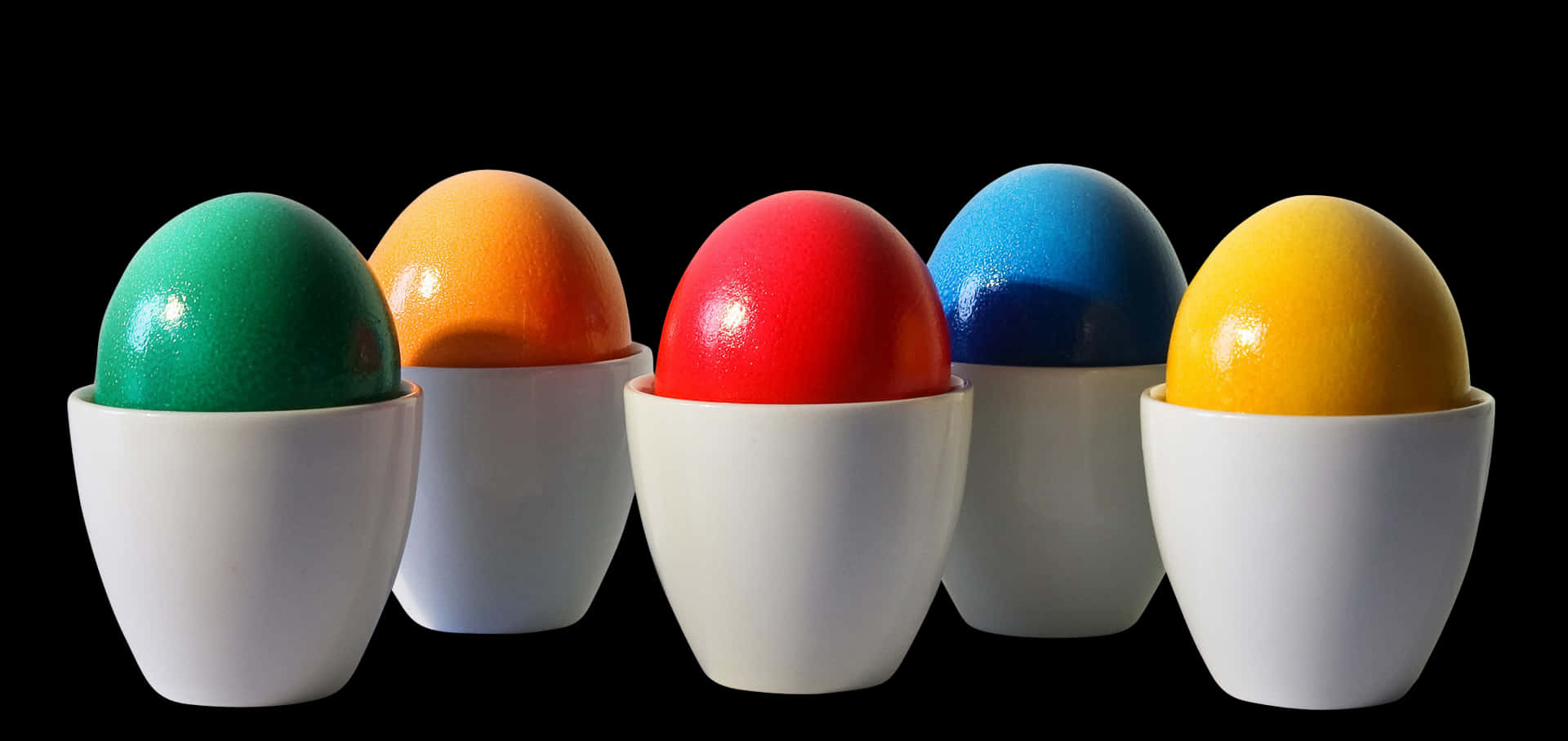 Colorful Eggsin Cupson Black Background PNG