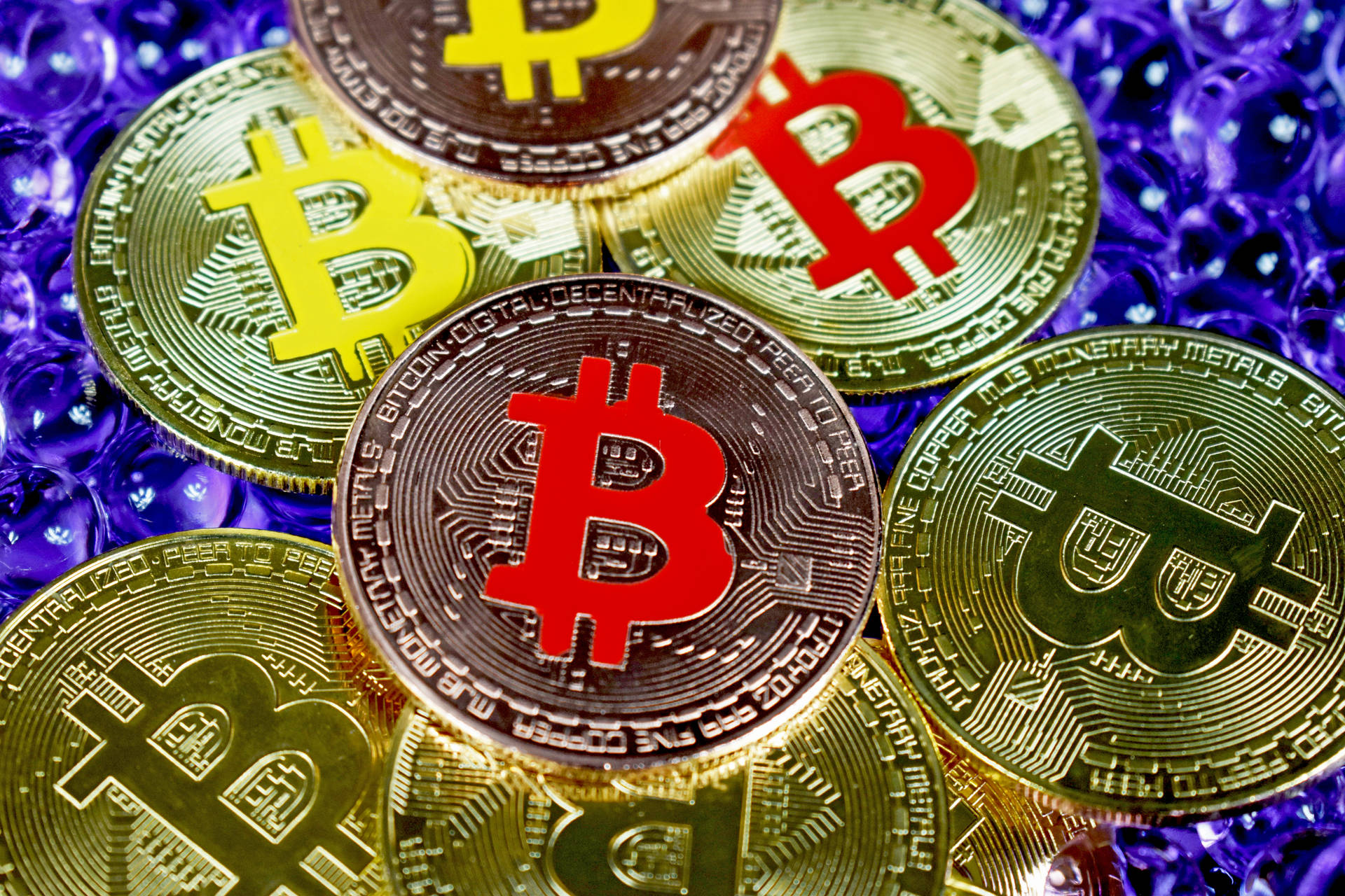Colorful Embossed Bitcoin Tokens Background