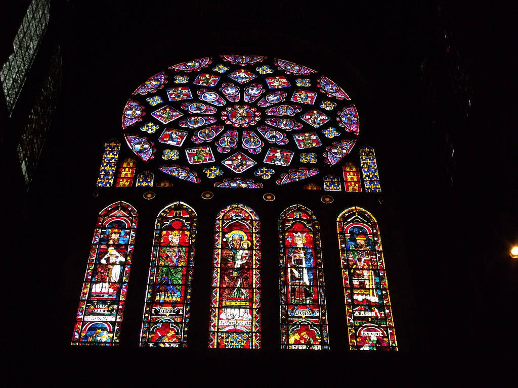 Majestic Stained Glass Artistry in Chartres Cathedral Wallpaper
