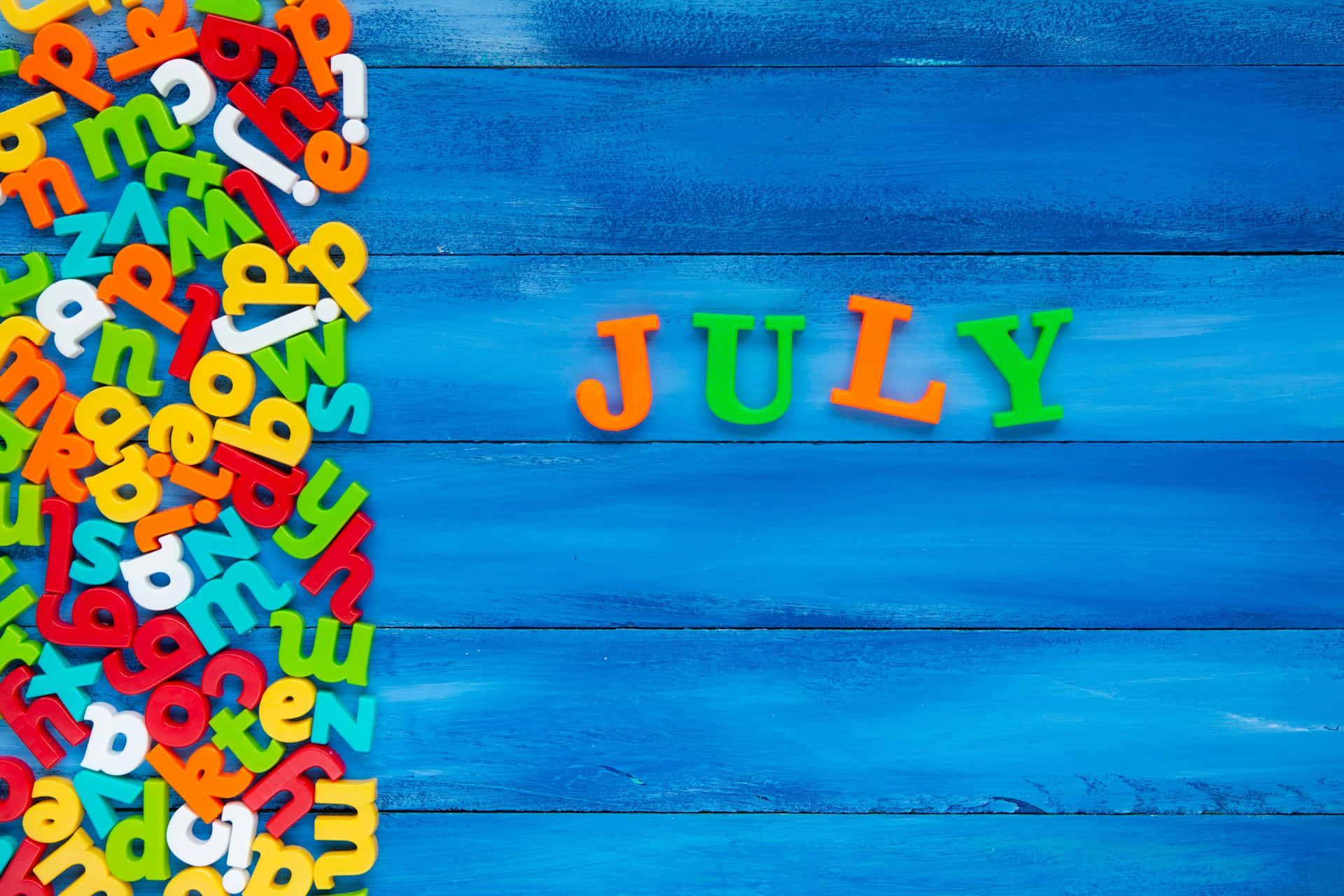 Colorful July Letterson Blue Background Wallpaper