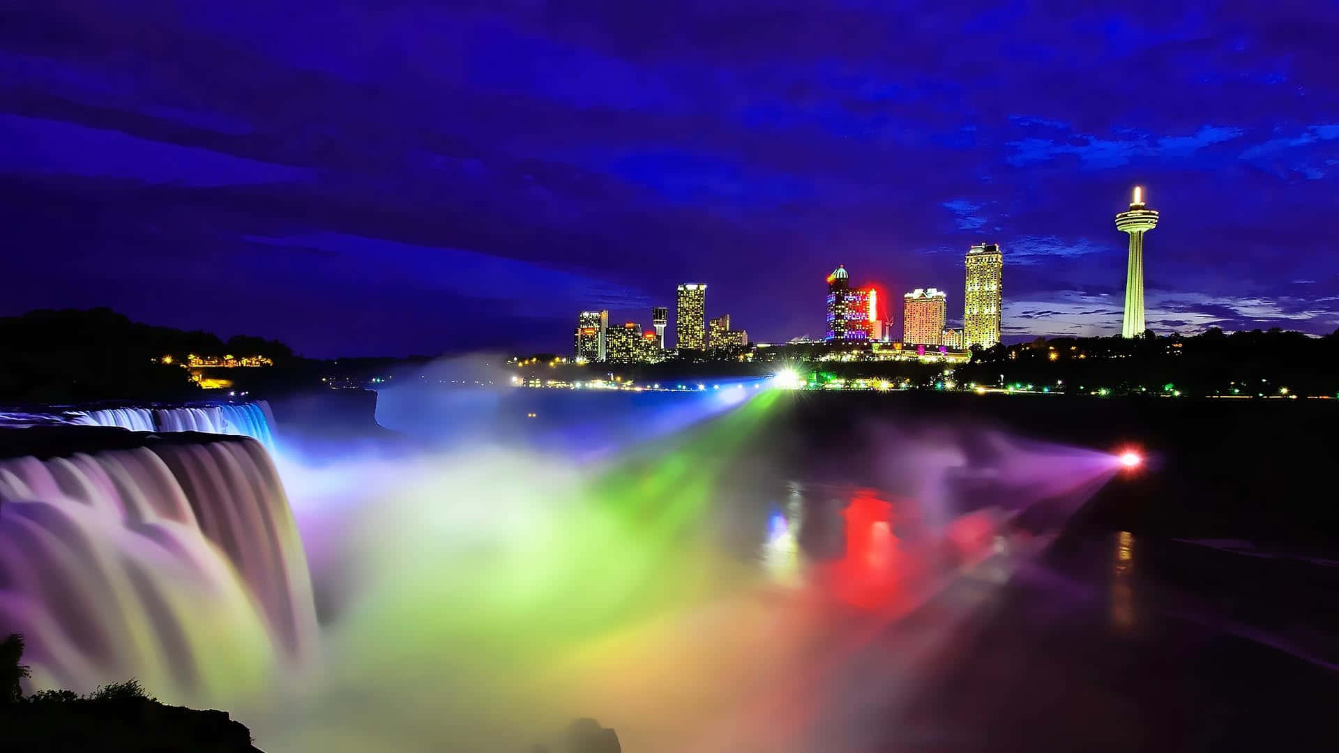 Färggladnattbelysning Vid Niagara Falls I Kanada. Wallpaper
