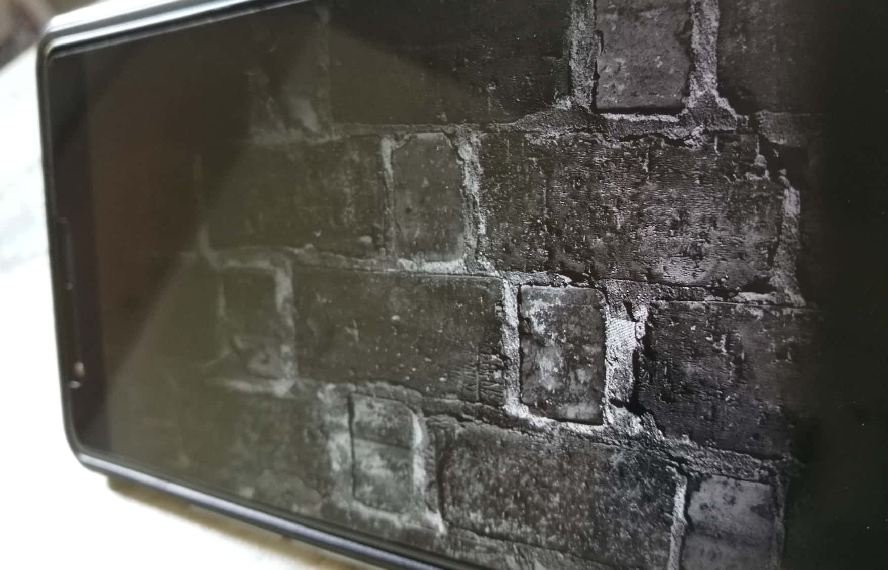 A Black And White Photo Of A Brick Wall Wallpaper