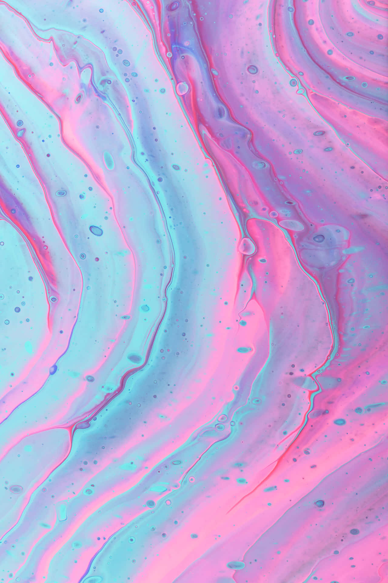 A Pink And Blue Liquid With Swirls Wallpaper