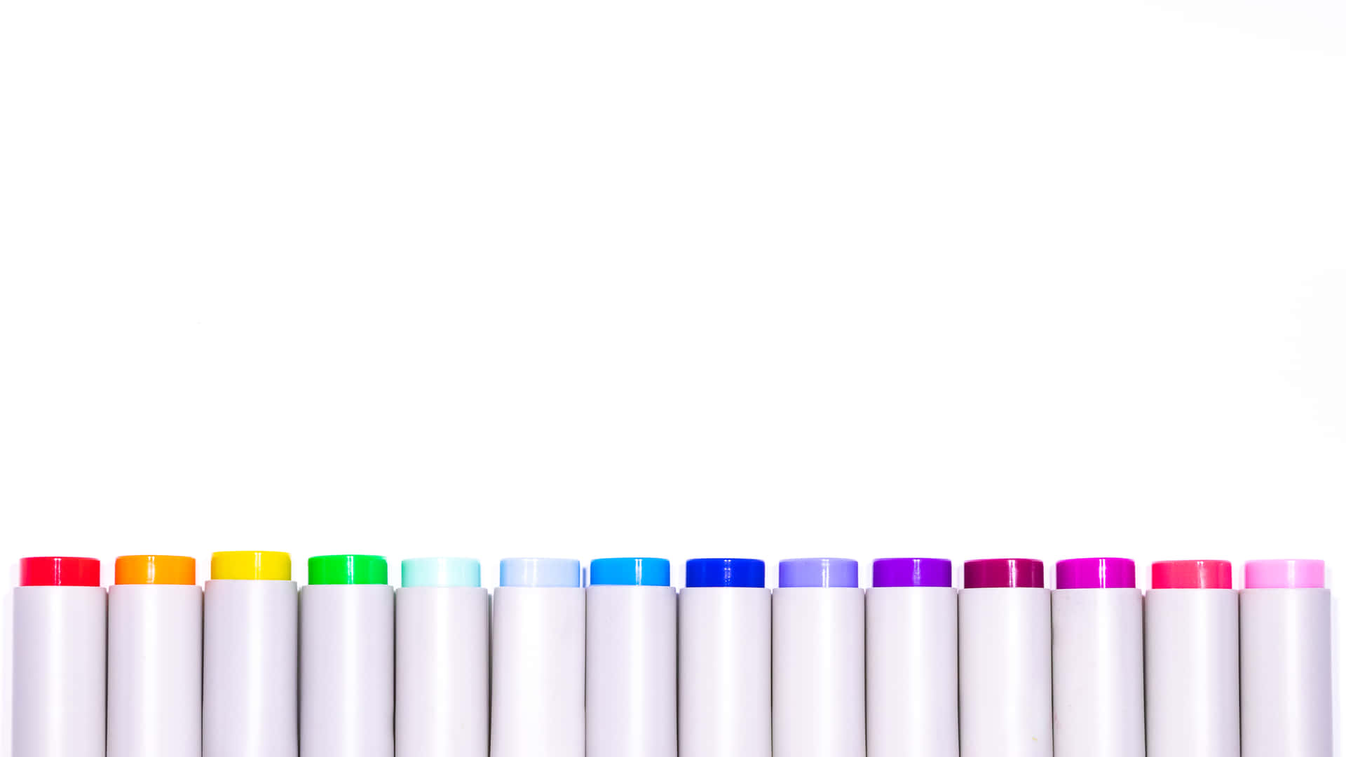 Colorful Pens Against A Neat Background Wallpaper