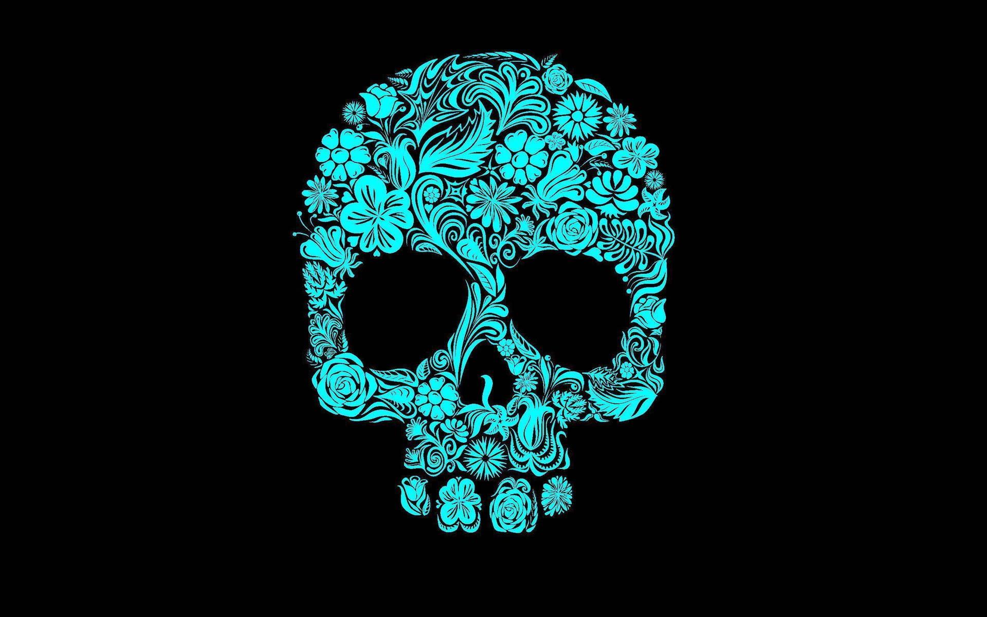 A Blue Skull With Floral Designs On A Black Background Wallpaper