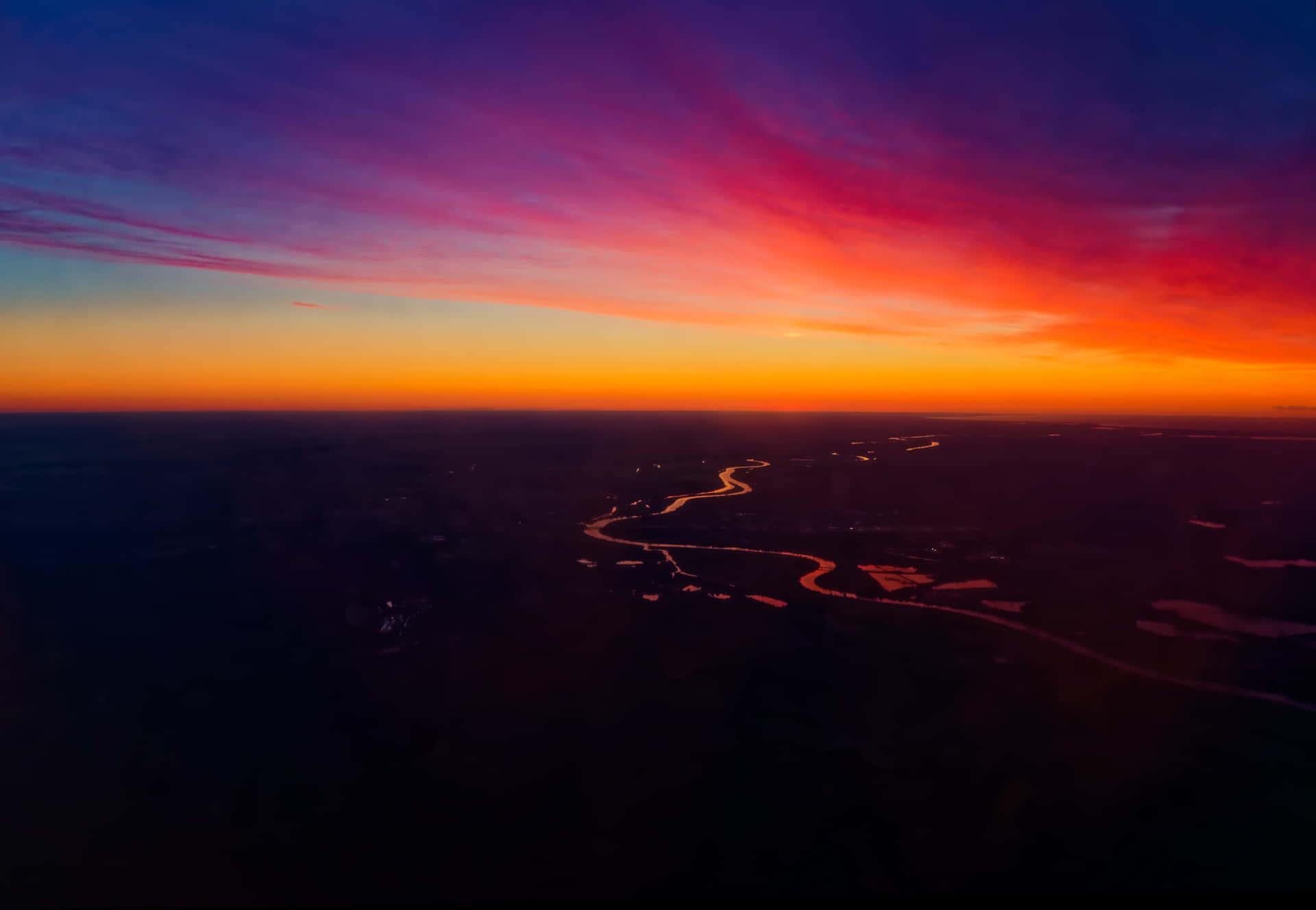 A Colorful Sunset Seen From An Airplane