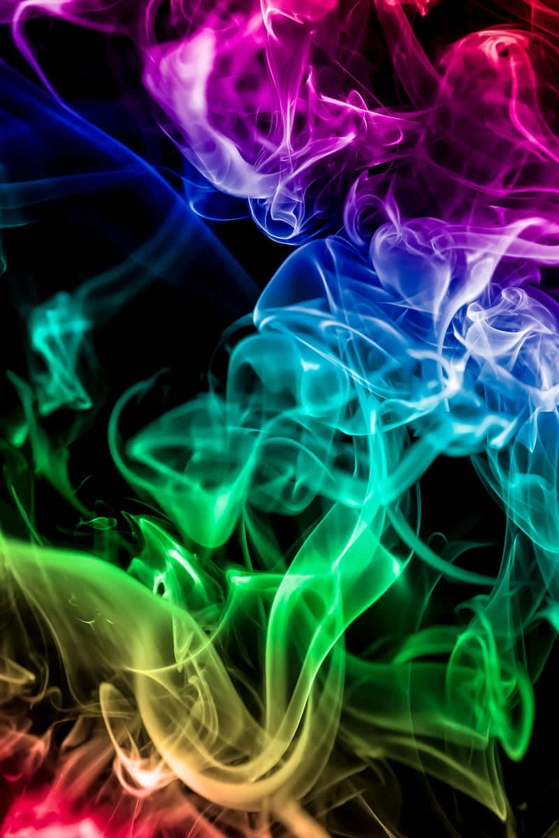 "An abstract shot of beautiful colorful smoke in an outdoor setting" Wallpaper