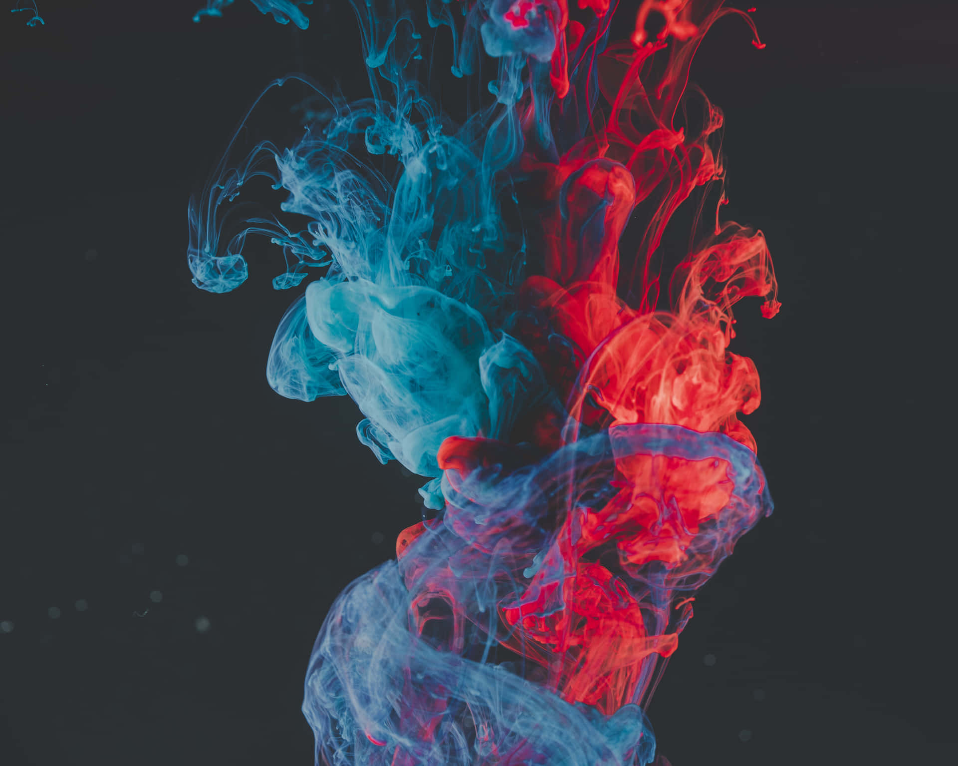 A Blue And Red Liquid Is Floating In The Air Wallpaper