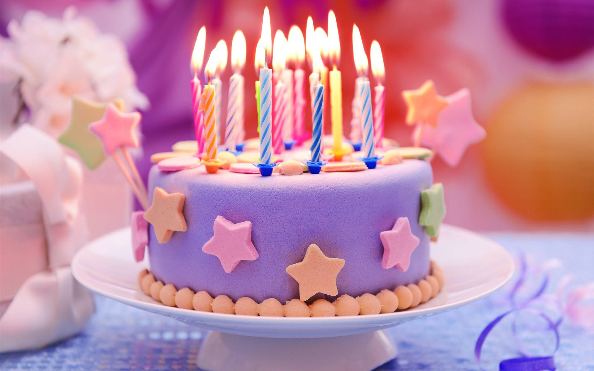 Colorful Stars Birthday Cake Candles Wallpaper