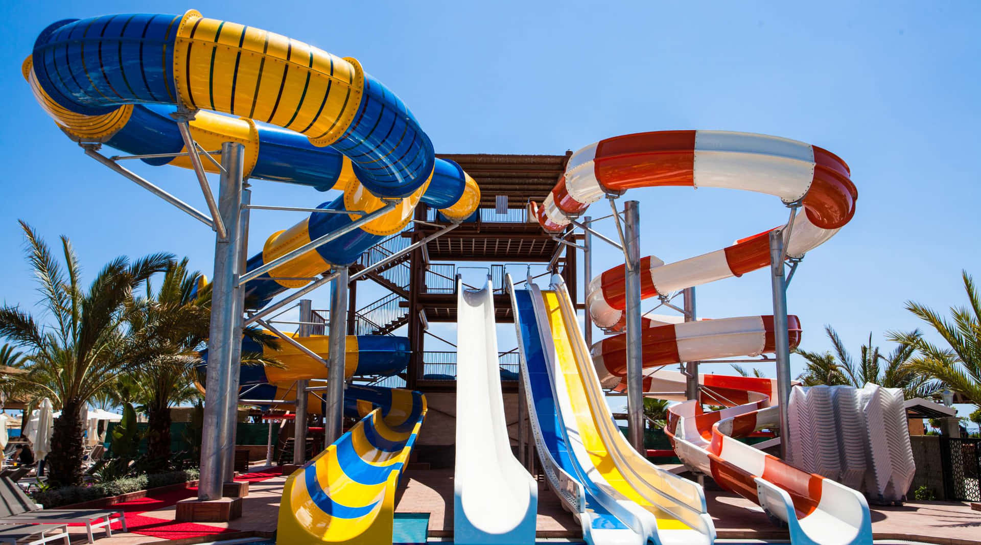 Colorful Water Slides At Aquatic Park Wallpaper