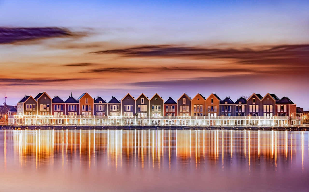 Colorful Waterfront Housesat Dusk Wallpaper