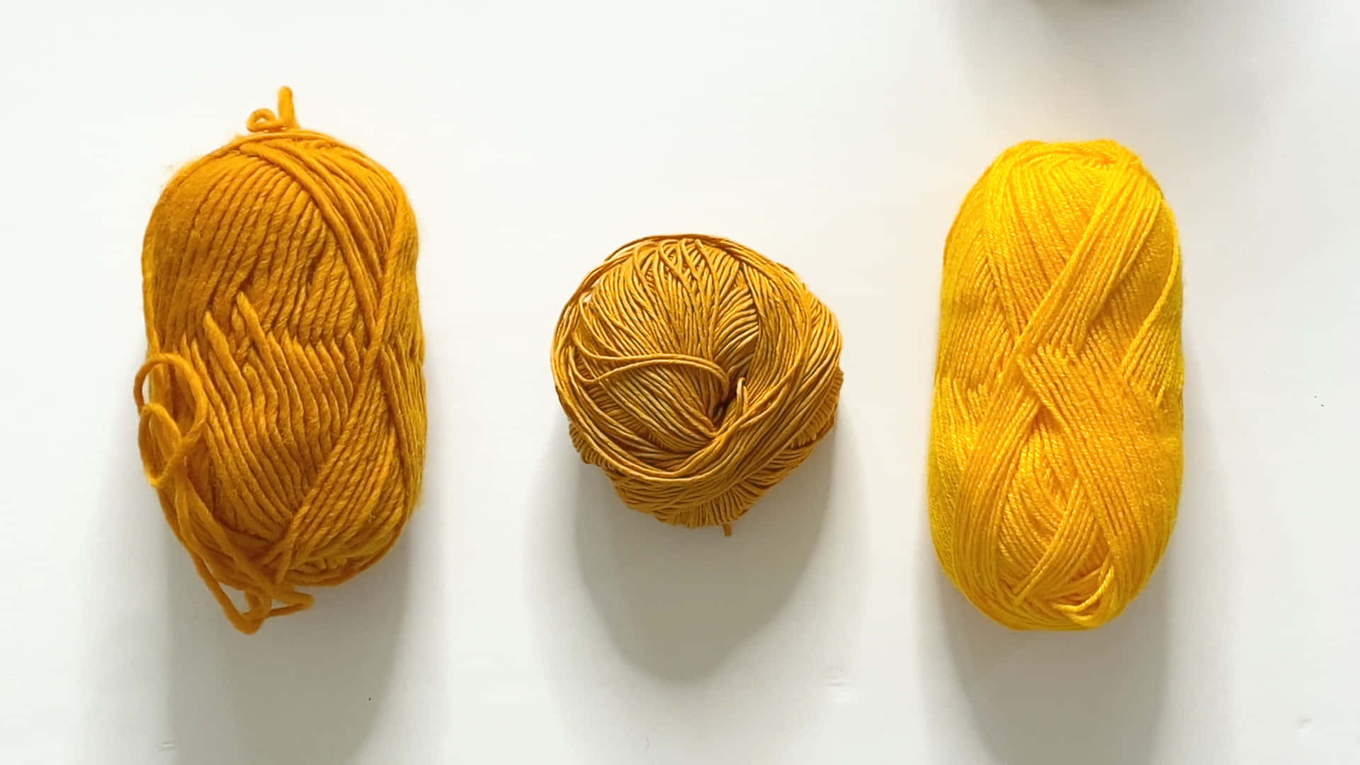 Colorful Yarn Bundles For Handicrafts Wallpaper