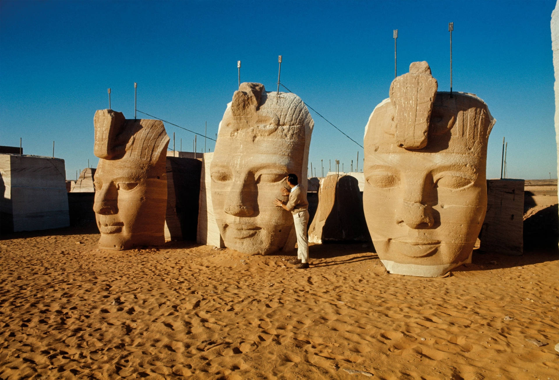 Colossal Statue's Faces At The Temple In Abu Simbel Wallpaper