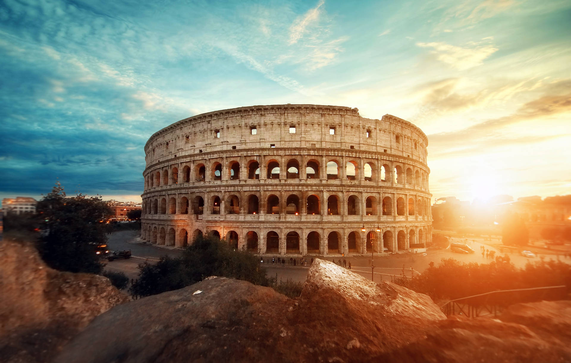 Colosseum With Beautiful And Blue Sky Overhead Wallpaper