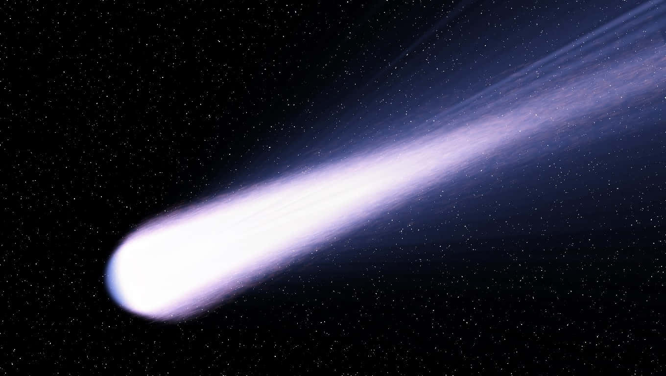 Stunning Comet Soaring Across the Night Sky Wallpaper