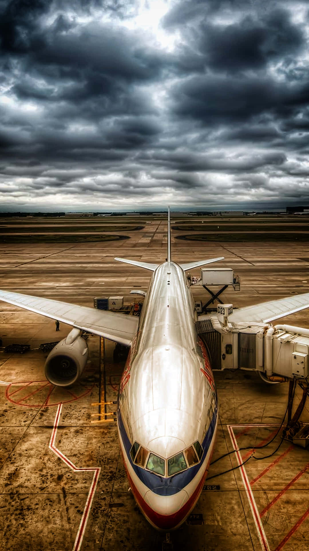 Commercial_ Aircraft_ Under_ Stormy_ Skies.jpg Wallpaper