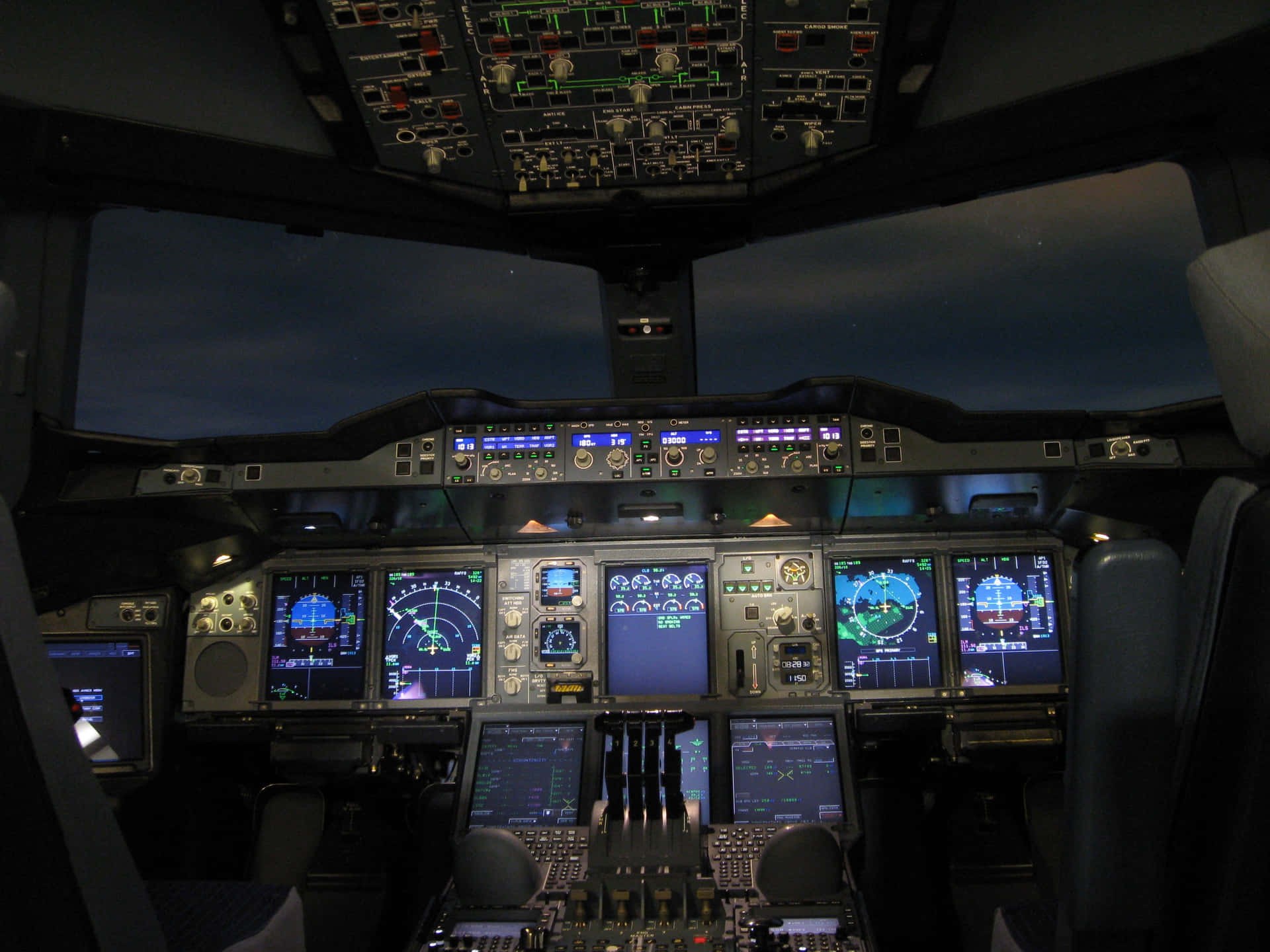 Commercial Airplane Cockpitat Night Wallpaper