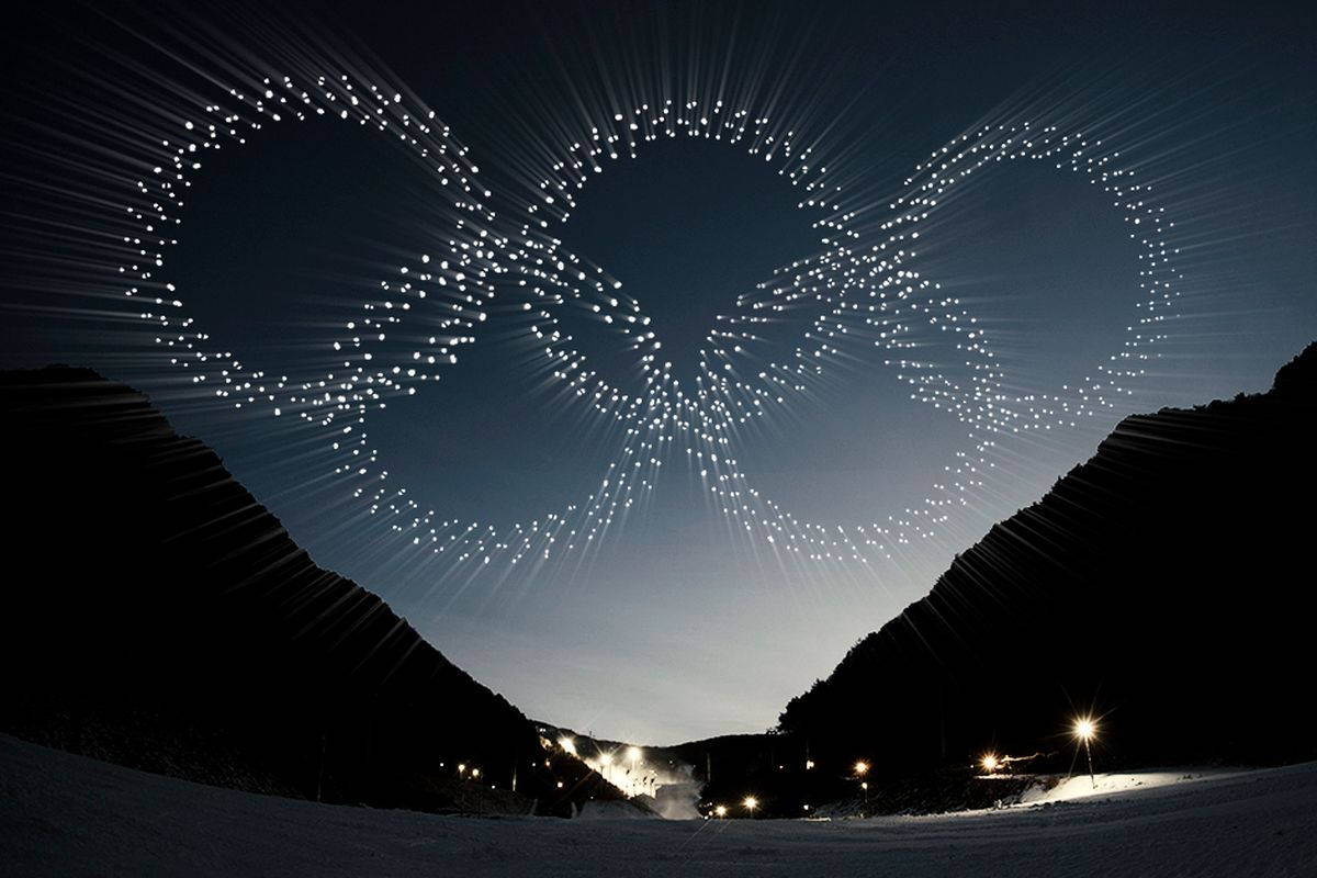 Competitive Ski Jumping In The Winter Olympics Wallpaper