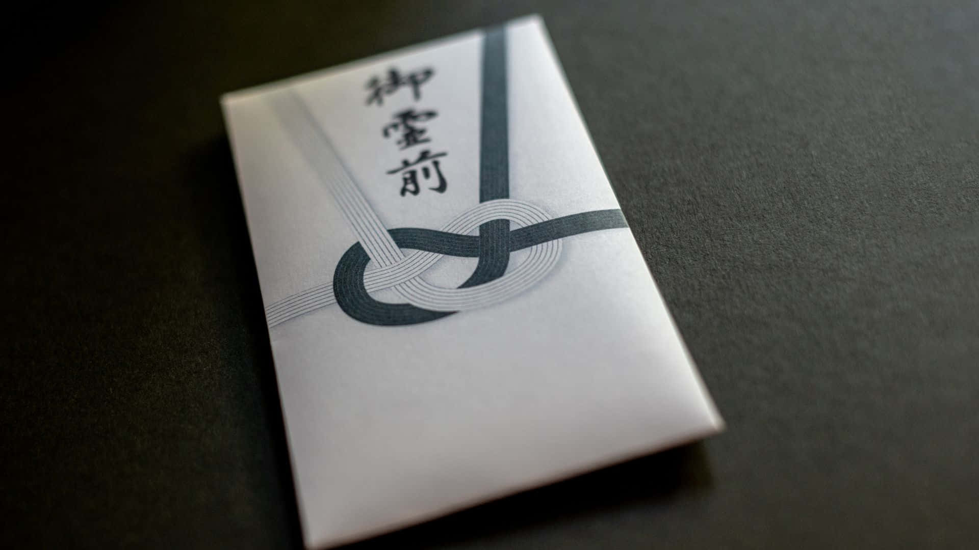 A Small Envelope With A Japanese Design On It