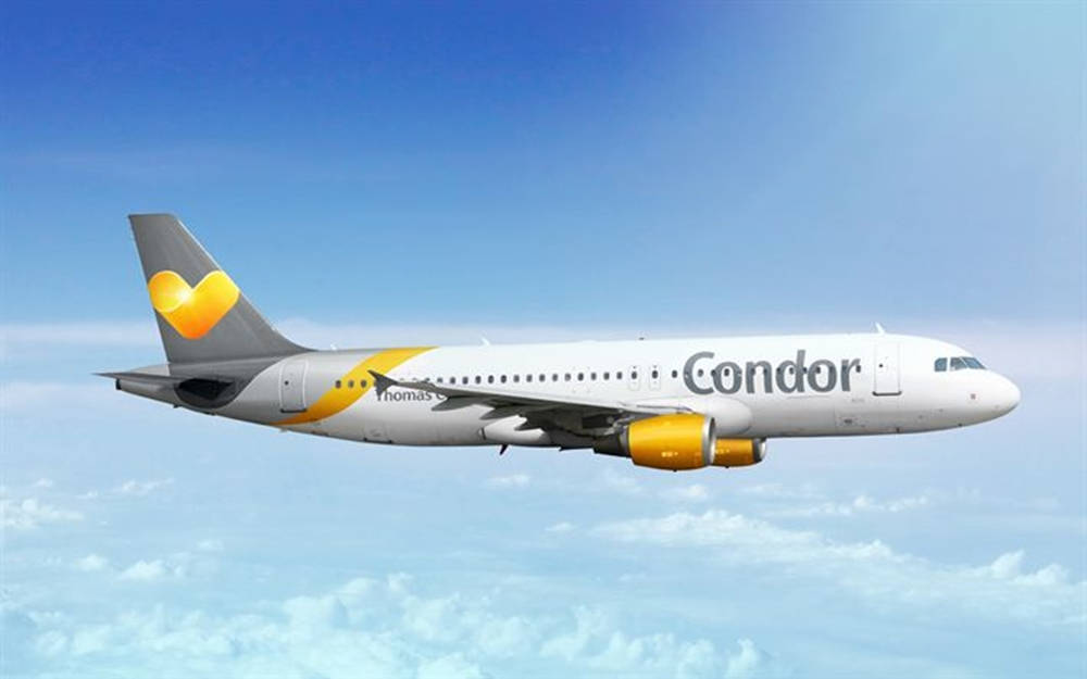 Condor Airlines Flying Airplane Above Clouds Wallpaper