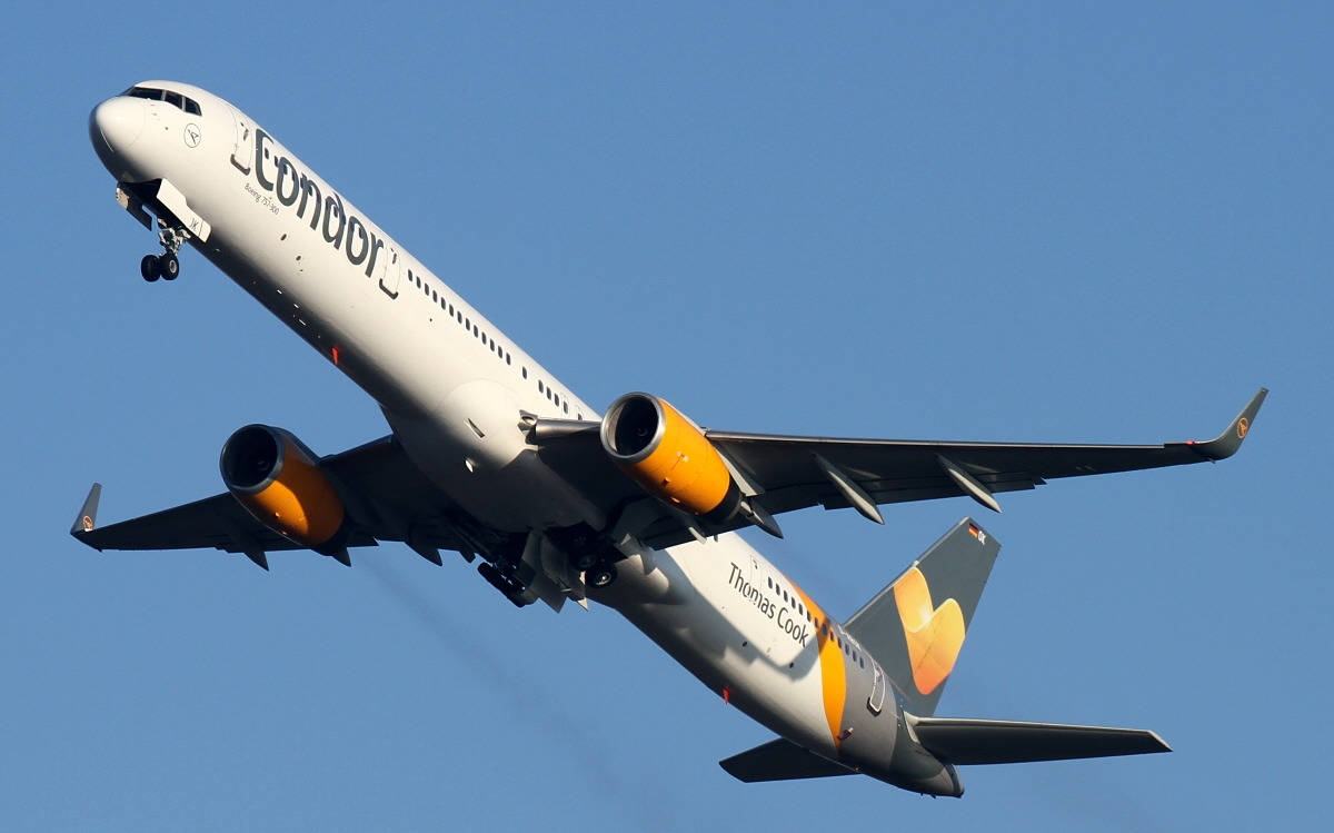 Condor Airlines Flying Airplane In Blue Sky Wallpaper
