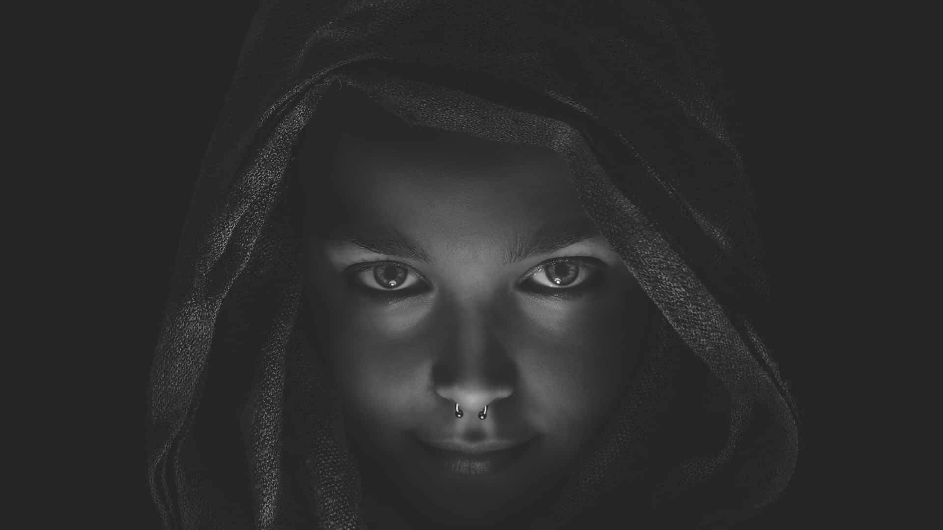 A Black And White Photo Of A Girl With A Hood Wallpaper