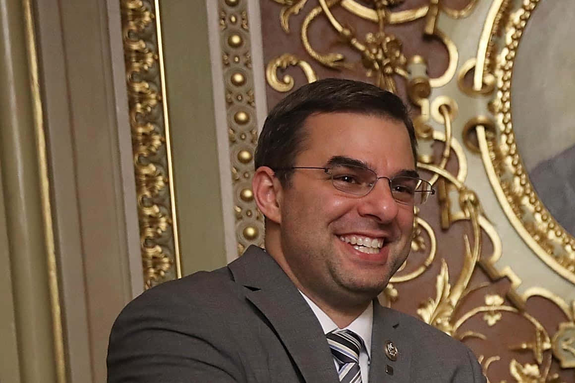 Congressman Justin Amash In A Professional Setting Wallpaper