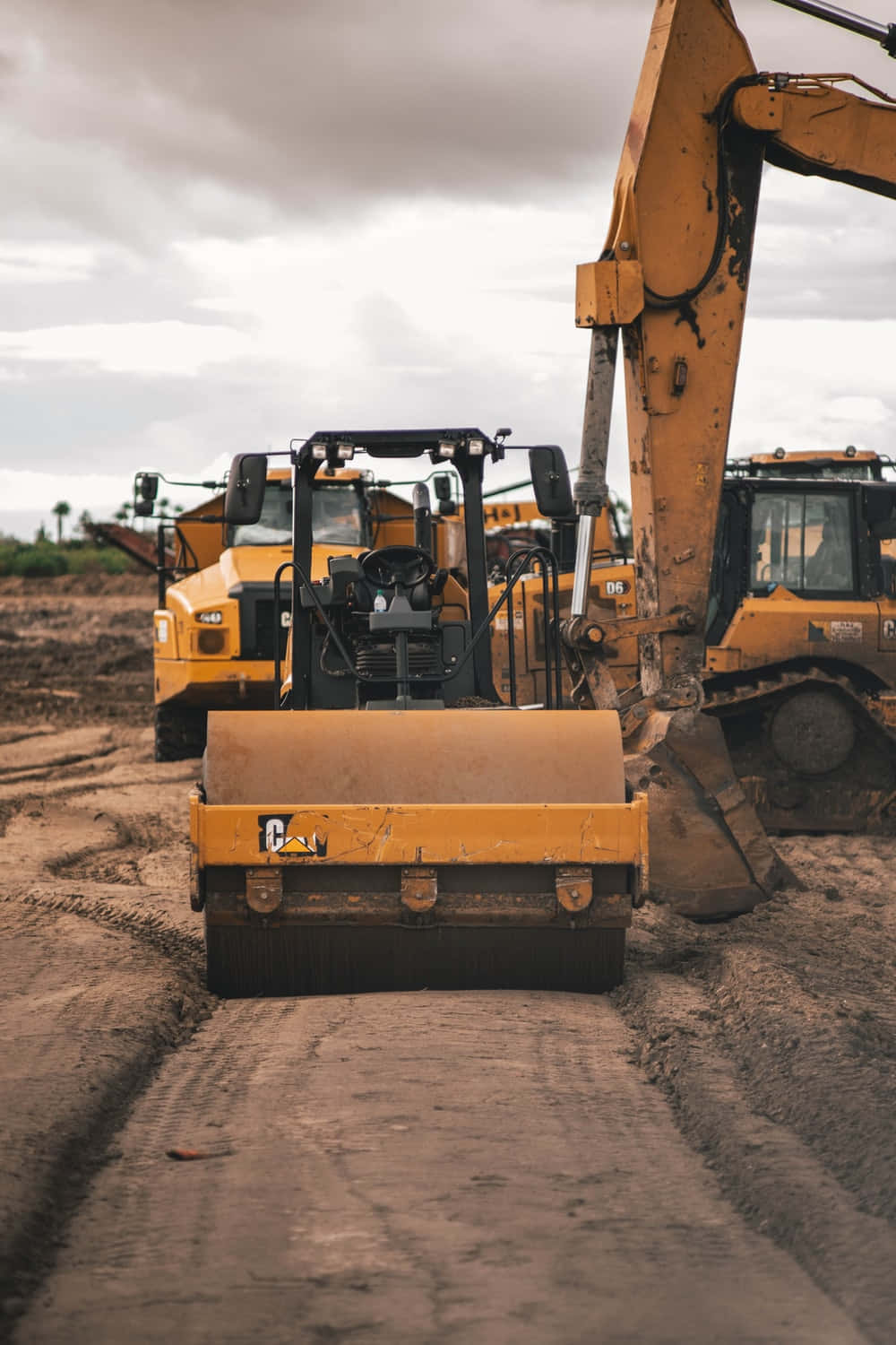 A Bulldozer Is Working On A Dirt Road