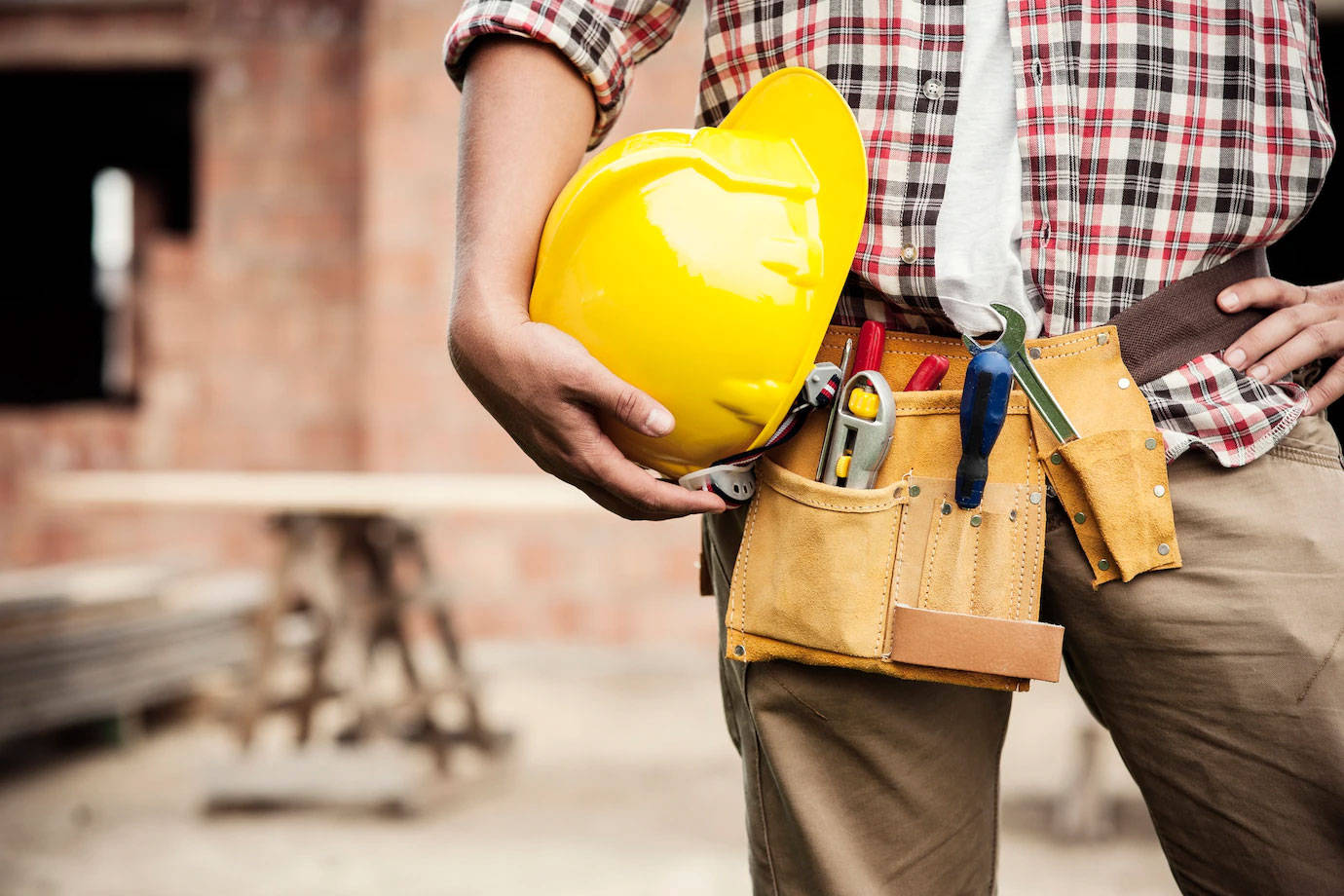 Construction Worker Tools Around His Hips Wallpaper