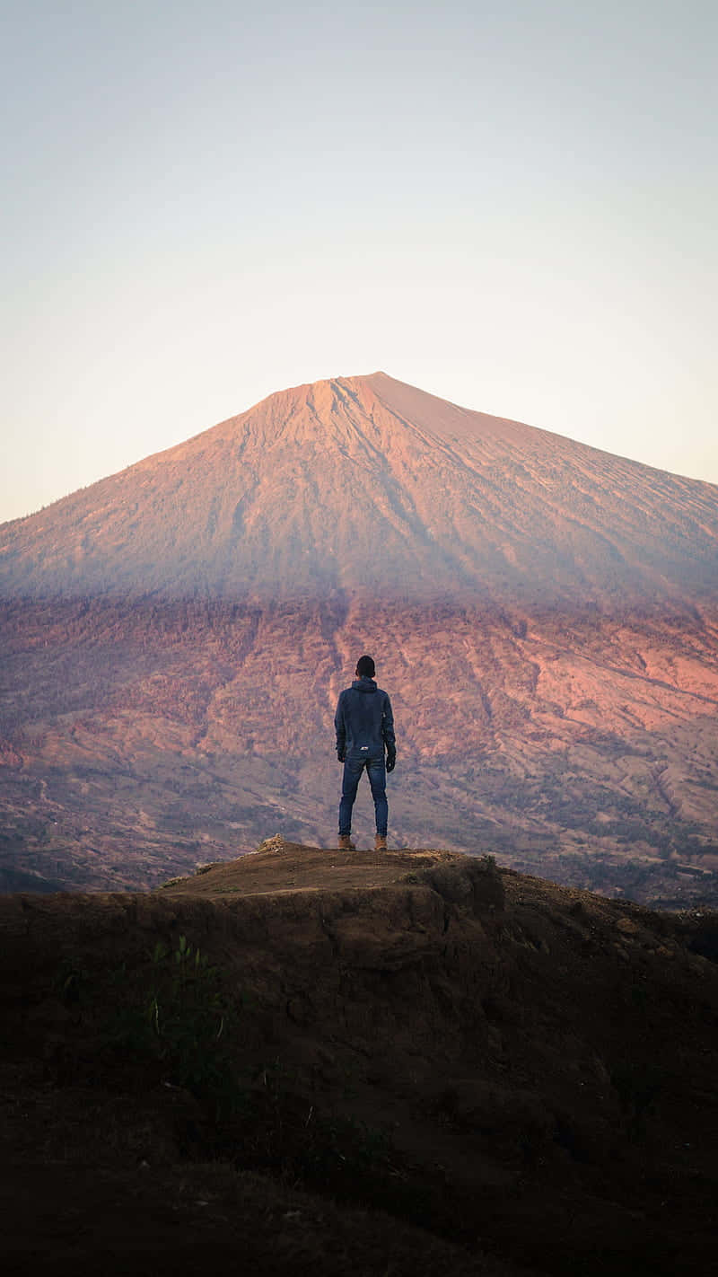 Contemplating_ Mountain_ Peak_ Sunset Wallpaper