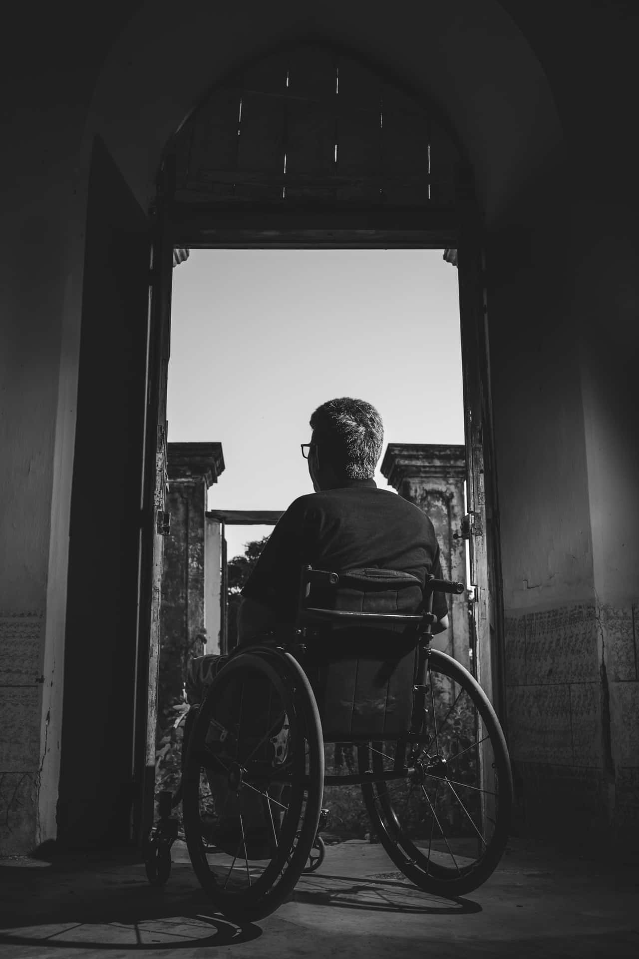 Contemplative Wheelchair User Archway Wallpaper