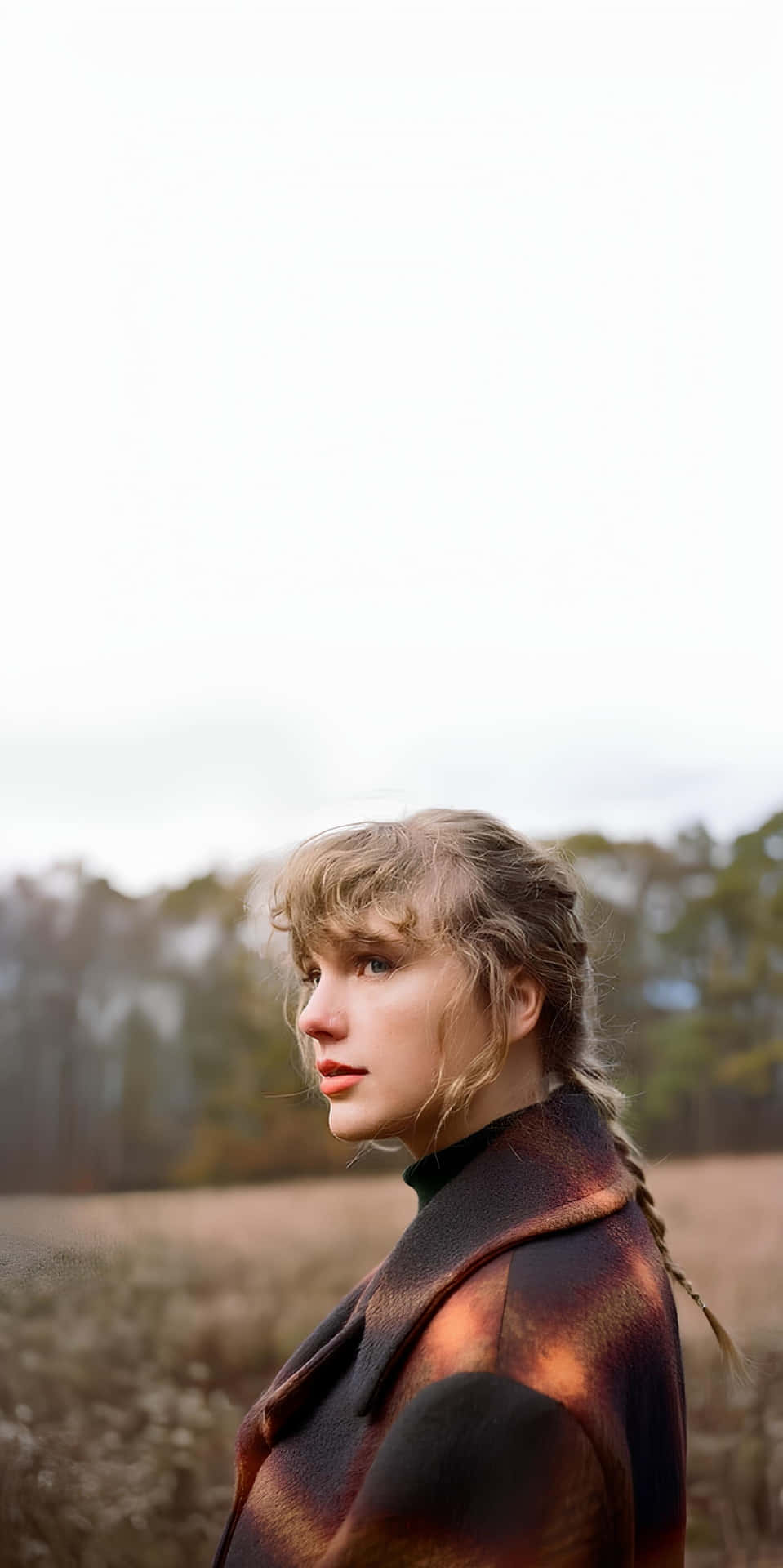 Contemplative Womanin Autumn Field Wallpaper