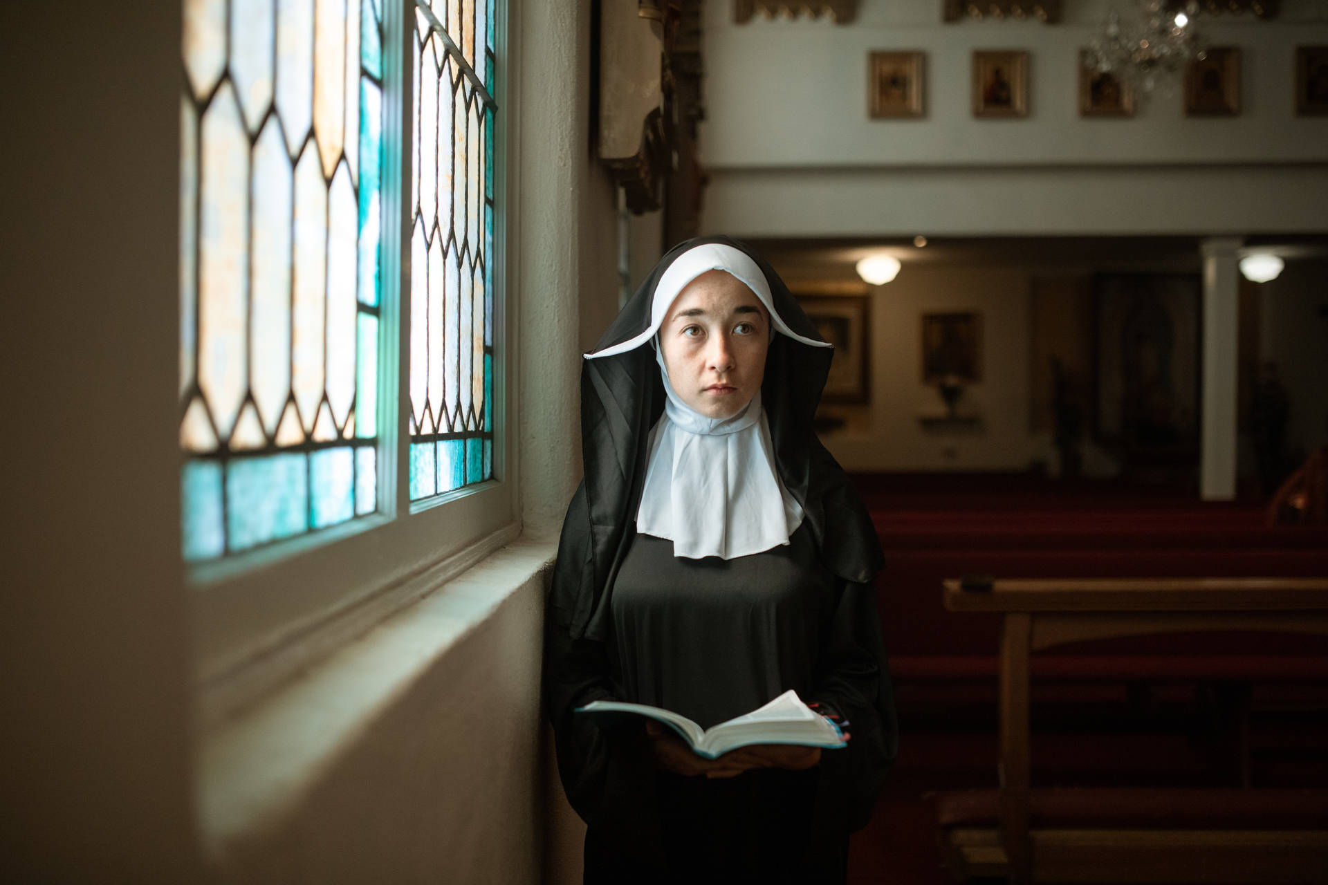 Convent Nun With Bible Wallpaper