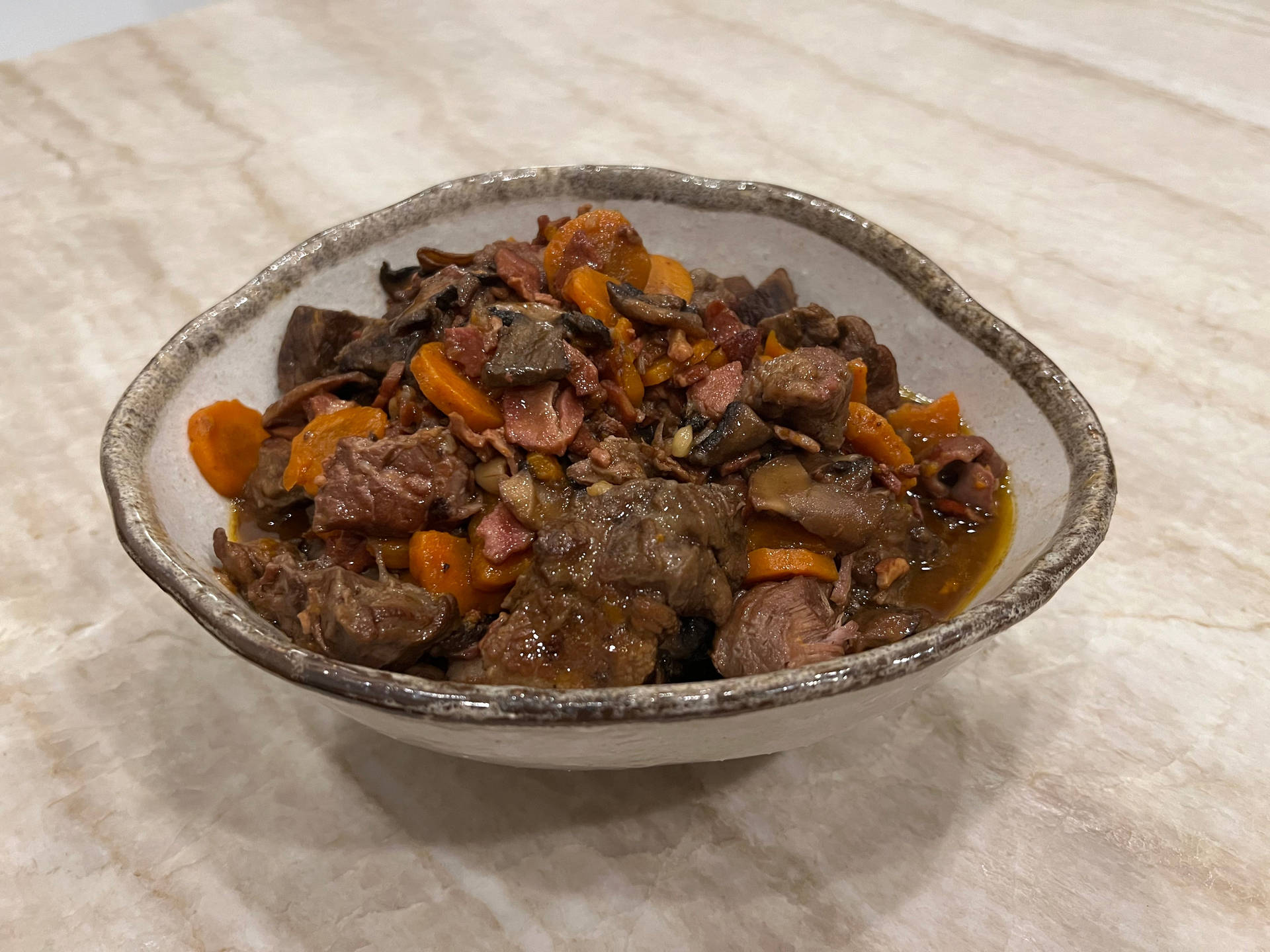 Mouthwatering Beef Bourguignon in Rustic Setting Wallpaper
