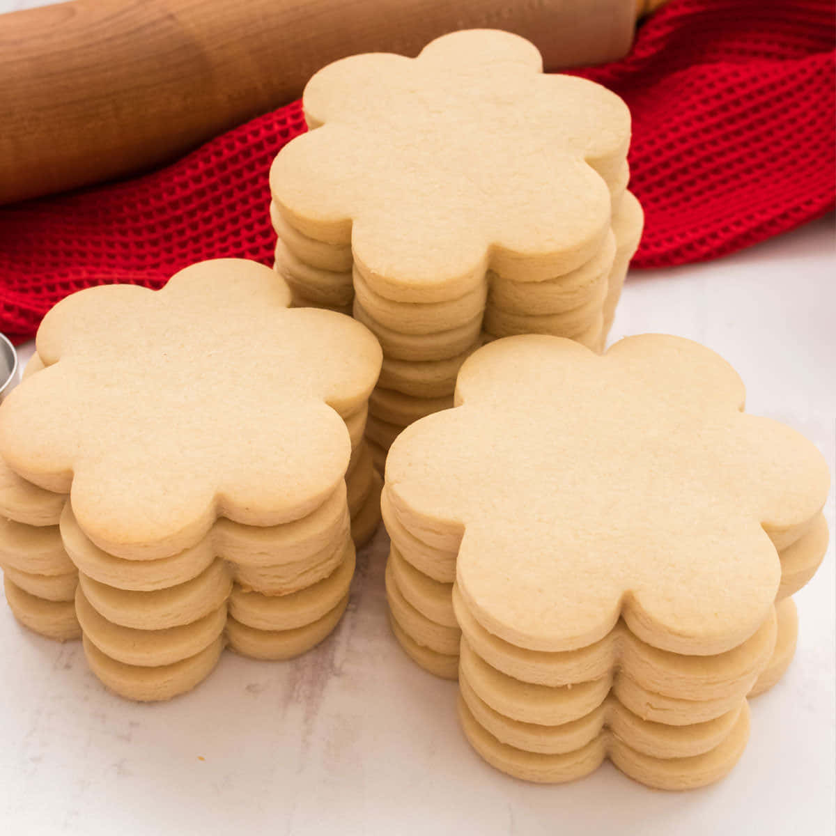 A Stack Of Sugar Cookies On A Table