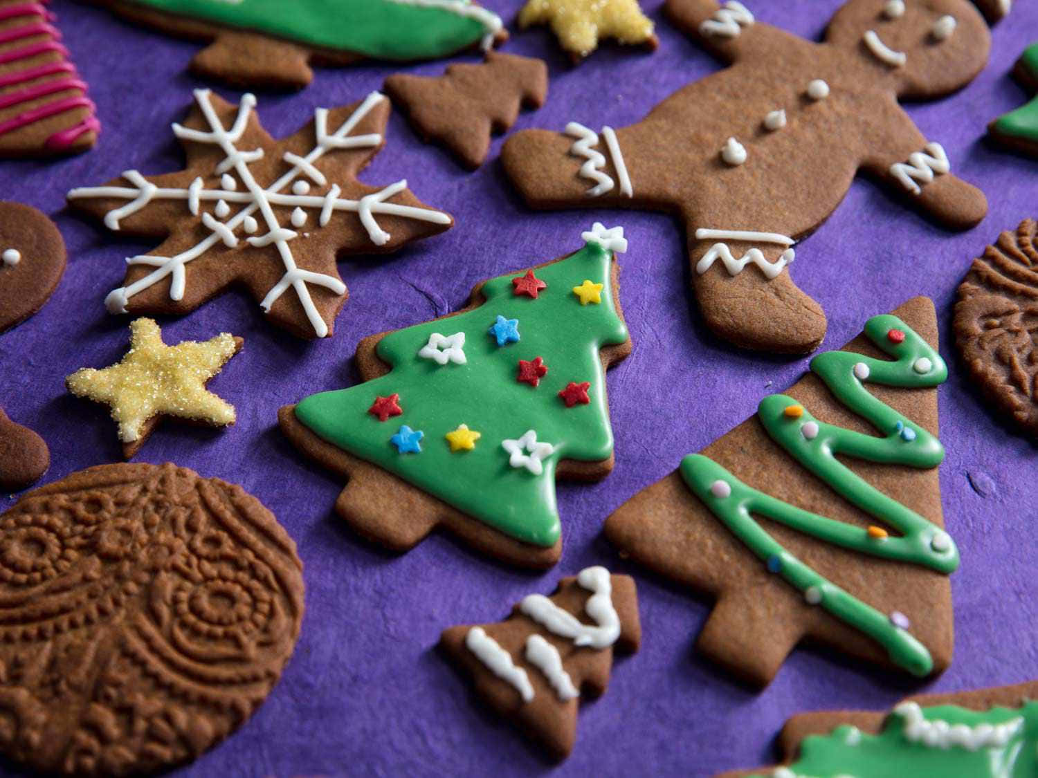 A Group Of Christmas Cookies With Decorations On Them