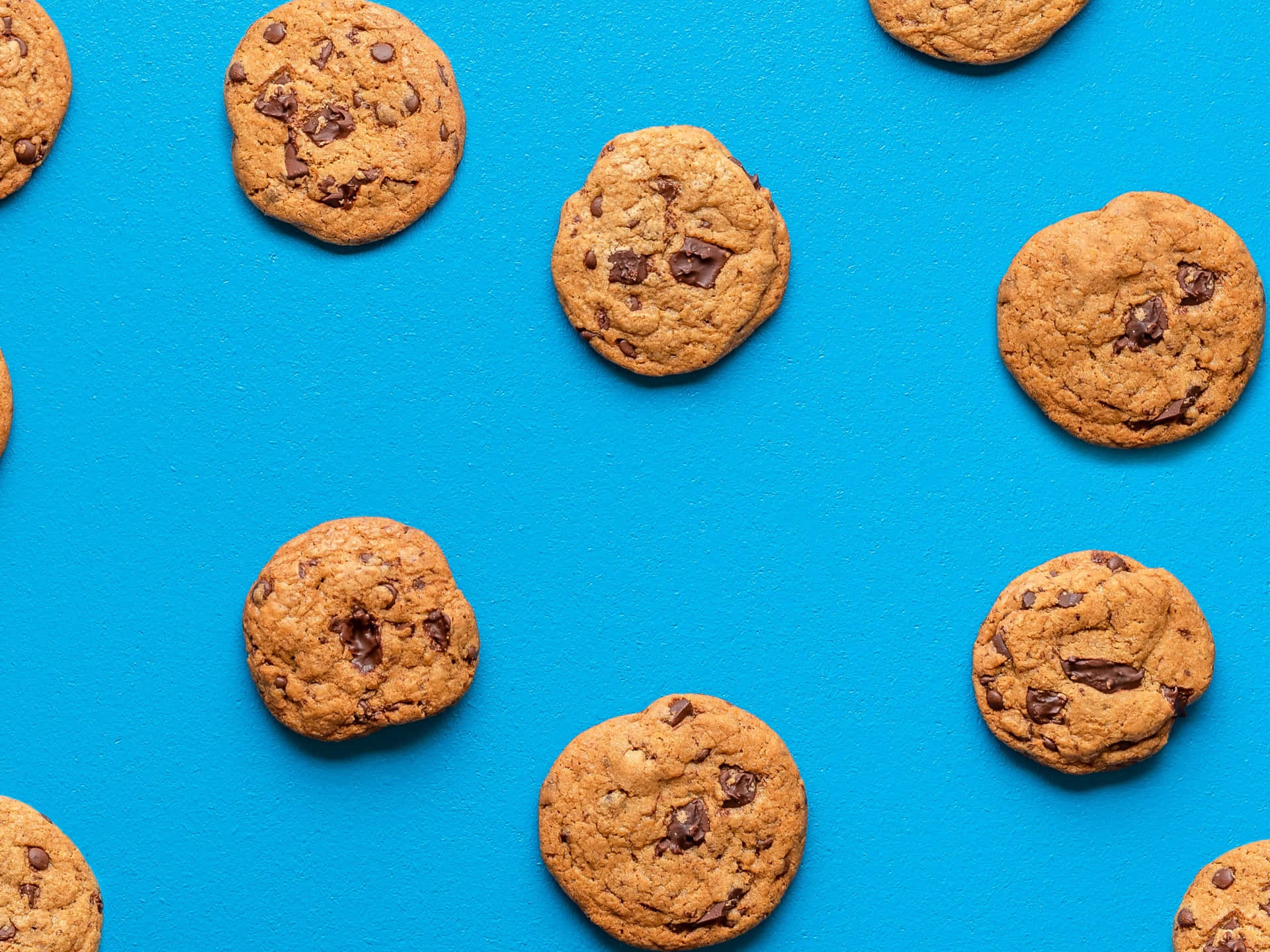 A Blue Background With A Group Of Cookies