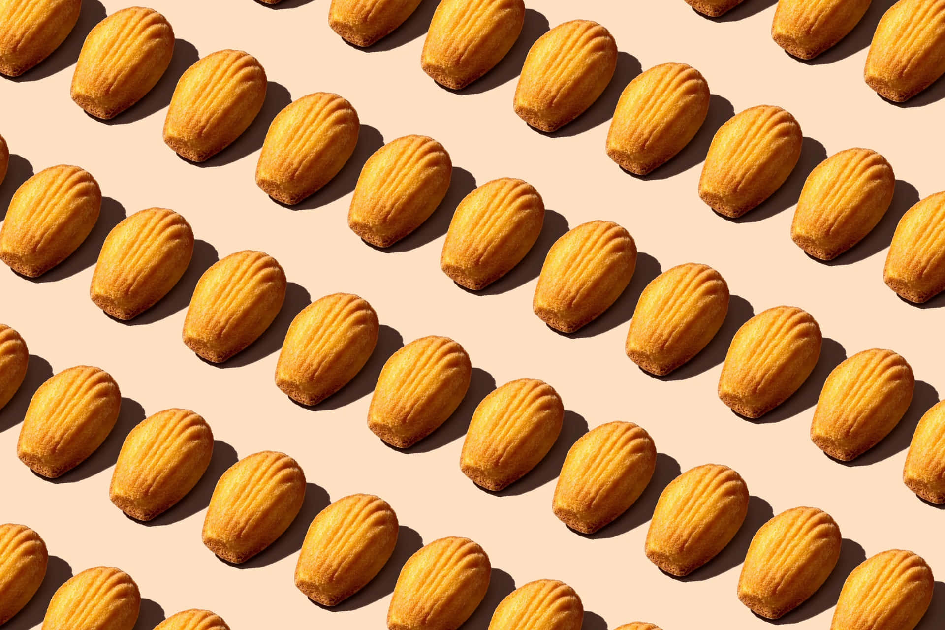 A Pattern Of Almonds On A Beige Background