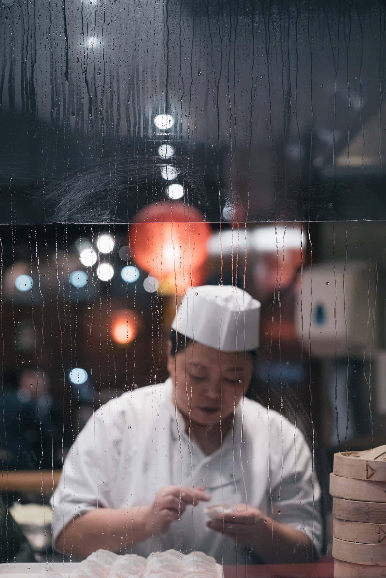A Chef Is Looking At A Menu In Front Of A Window