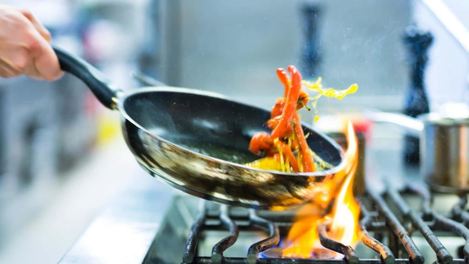 A Person Is Frying Food On A Stove