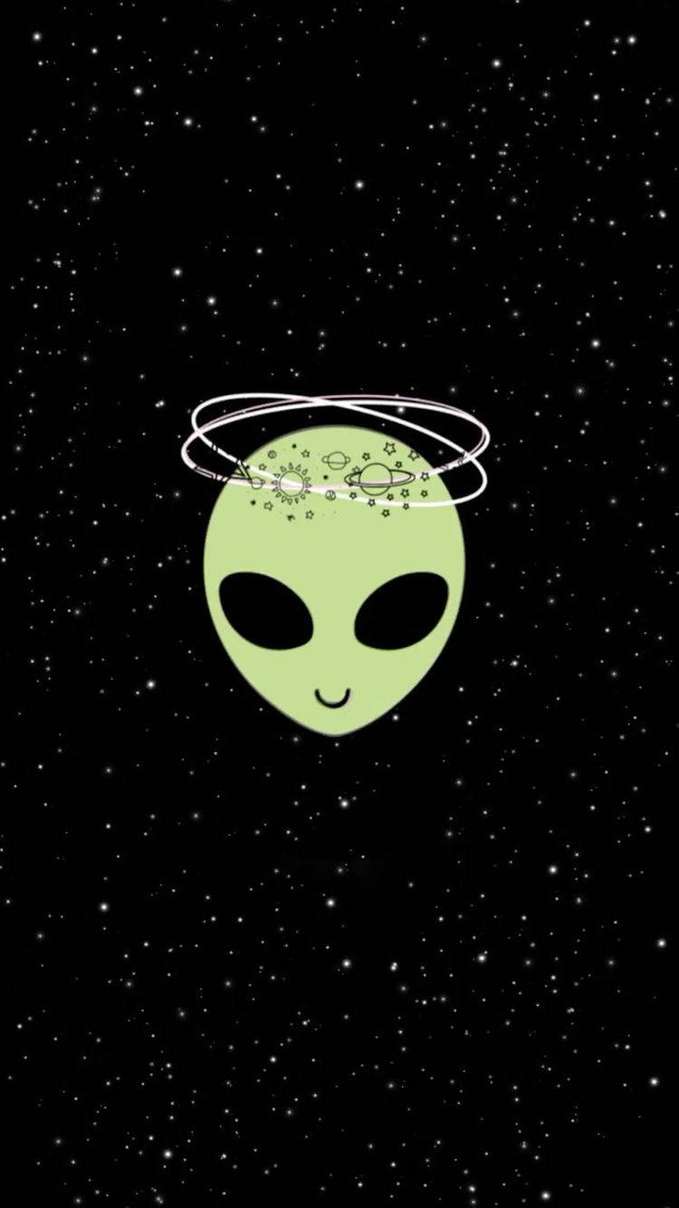 En alien med et smilende ansigt i himlen Wallpaper