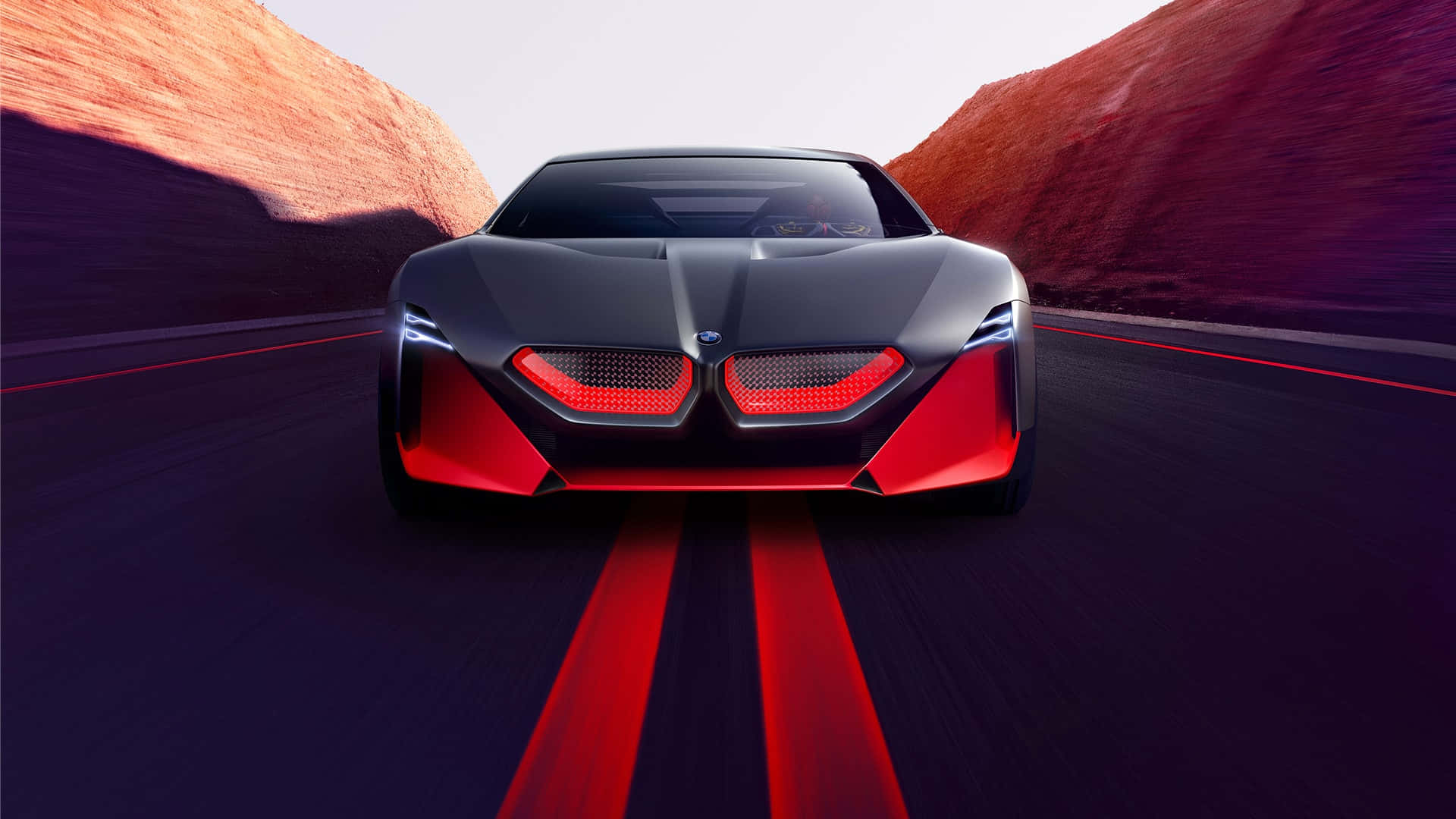 Bmw I8 Concept Car Driving Down A Mountain Road