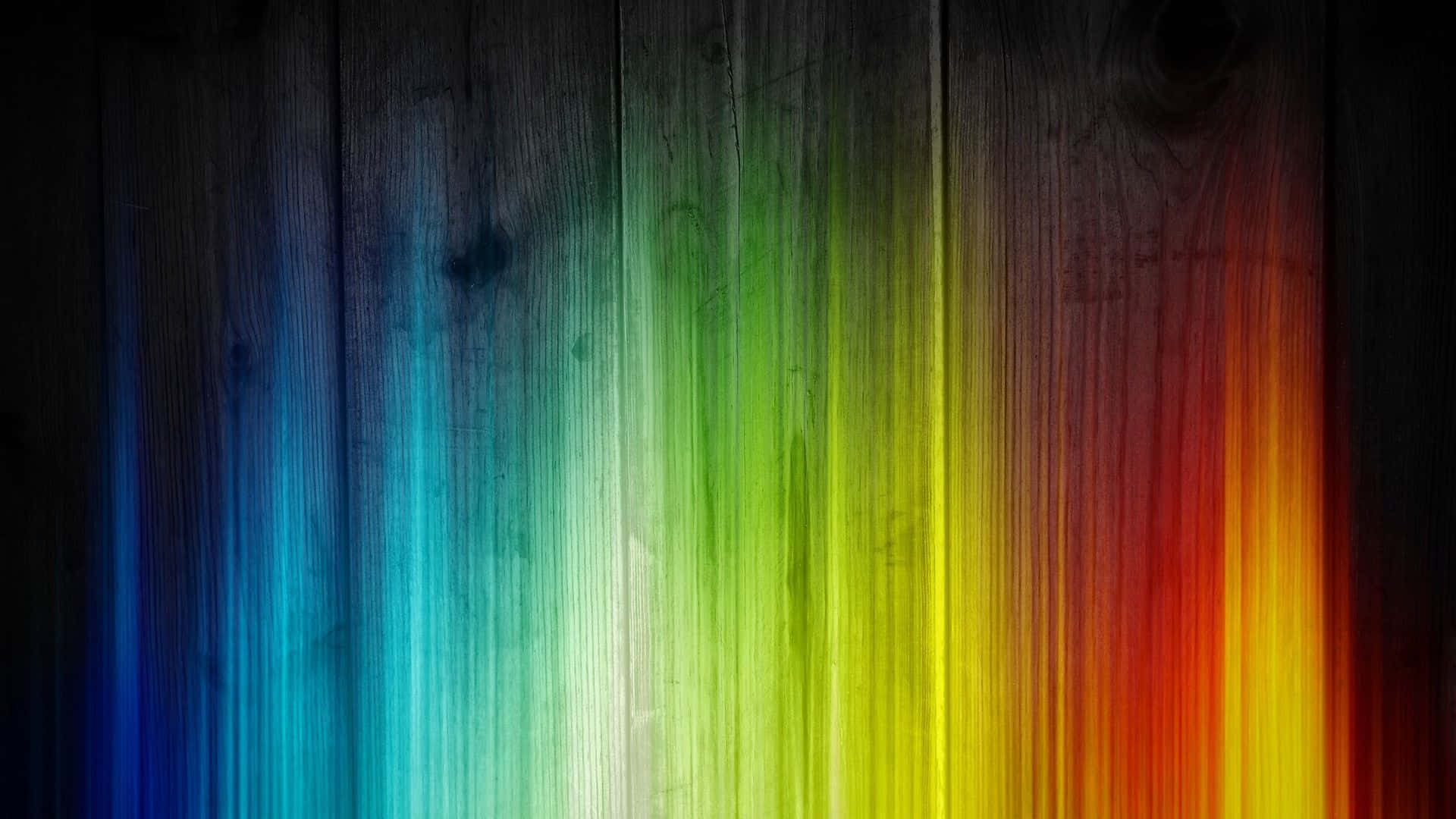 A Colorful Rainbow Stripe On A Wooden Background Wallpaper