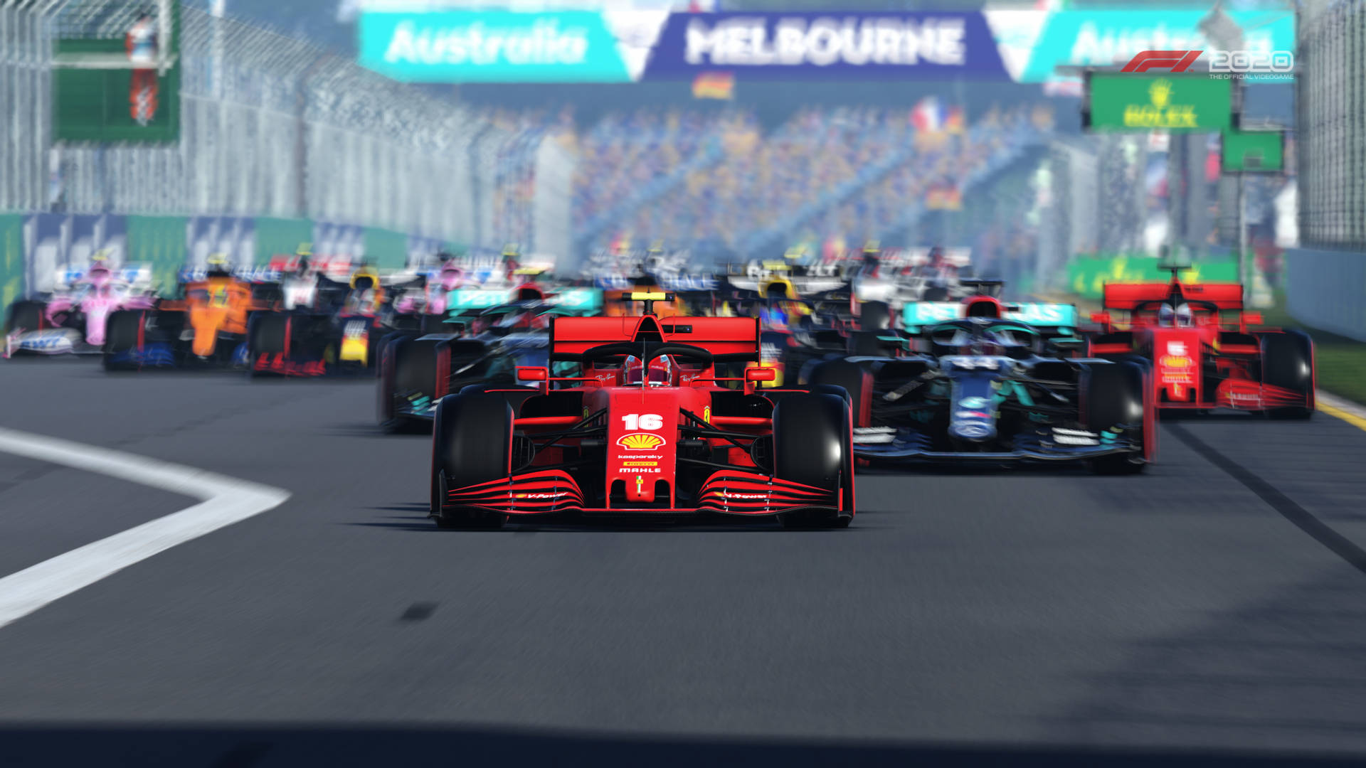 A Race Track With Many Cars Racing In Front Of A Crowd Wallpaper